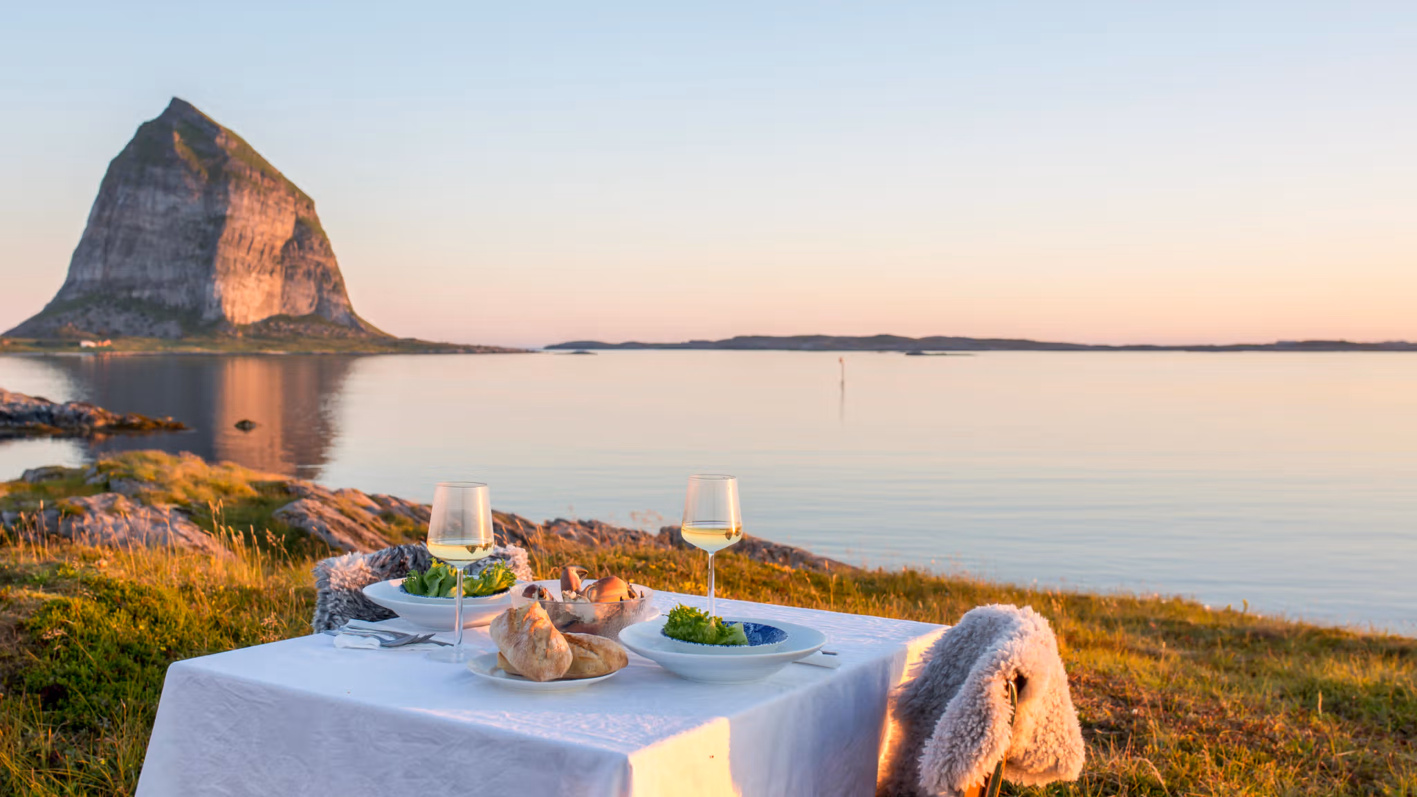 A romantic dinner table by the sea at Træna in Helgeland, Northern Norway