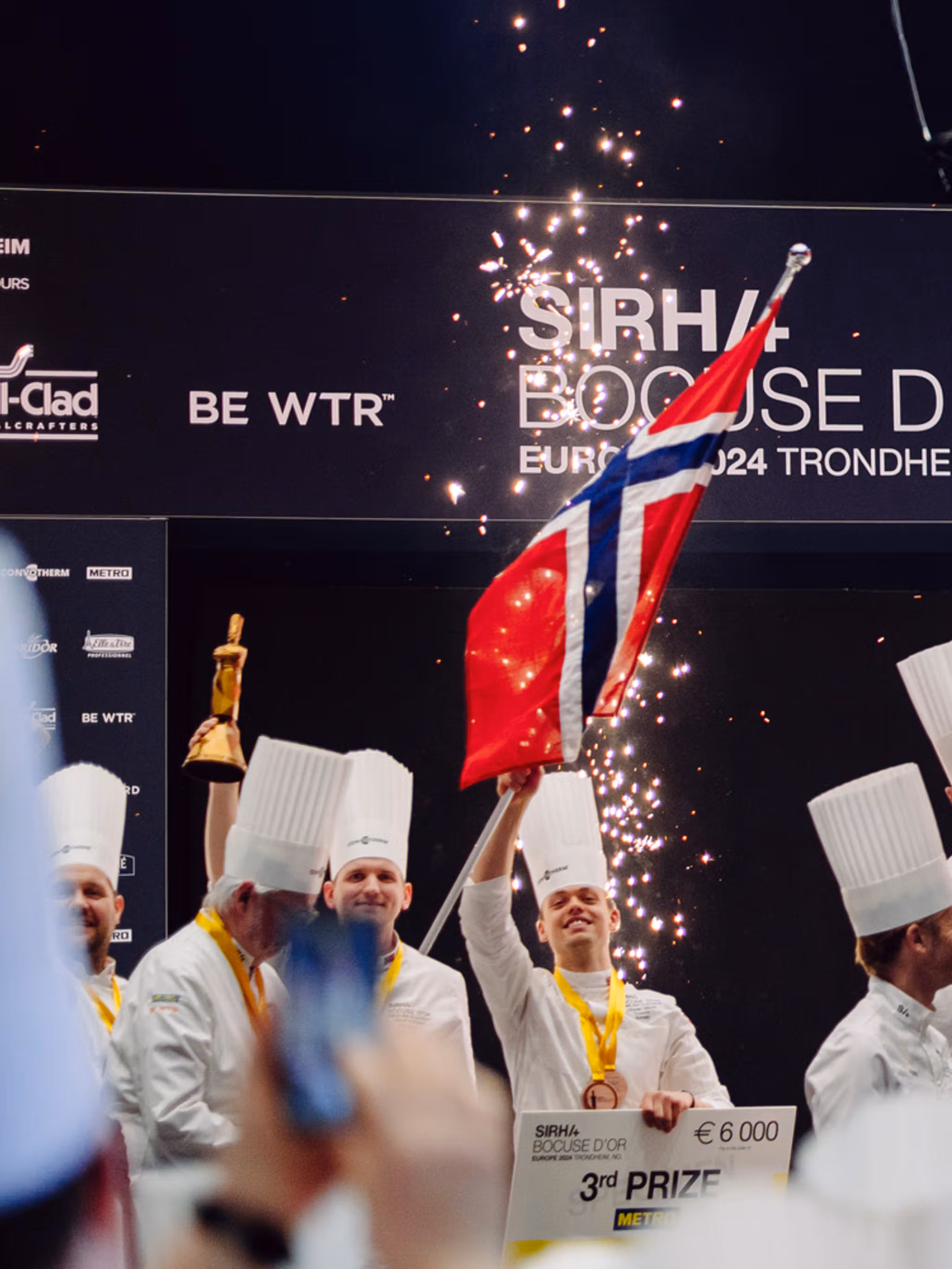 The Norwegian, Danish and Swedish team celebrating on the podium.