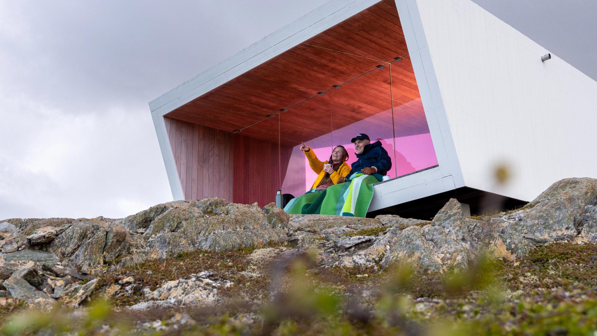Two poeple sitting in Domen viewpoint by Biptope in Varanger, Northern Norway