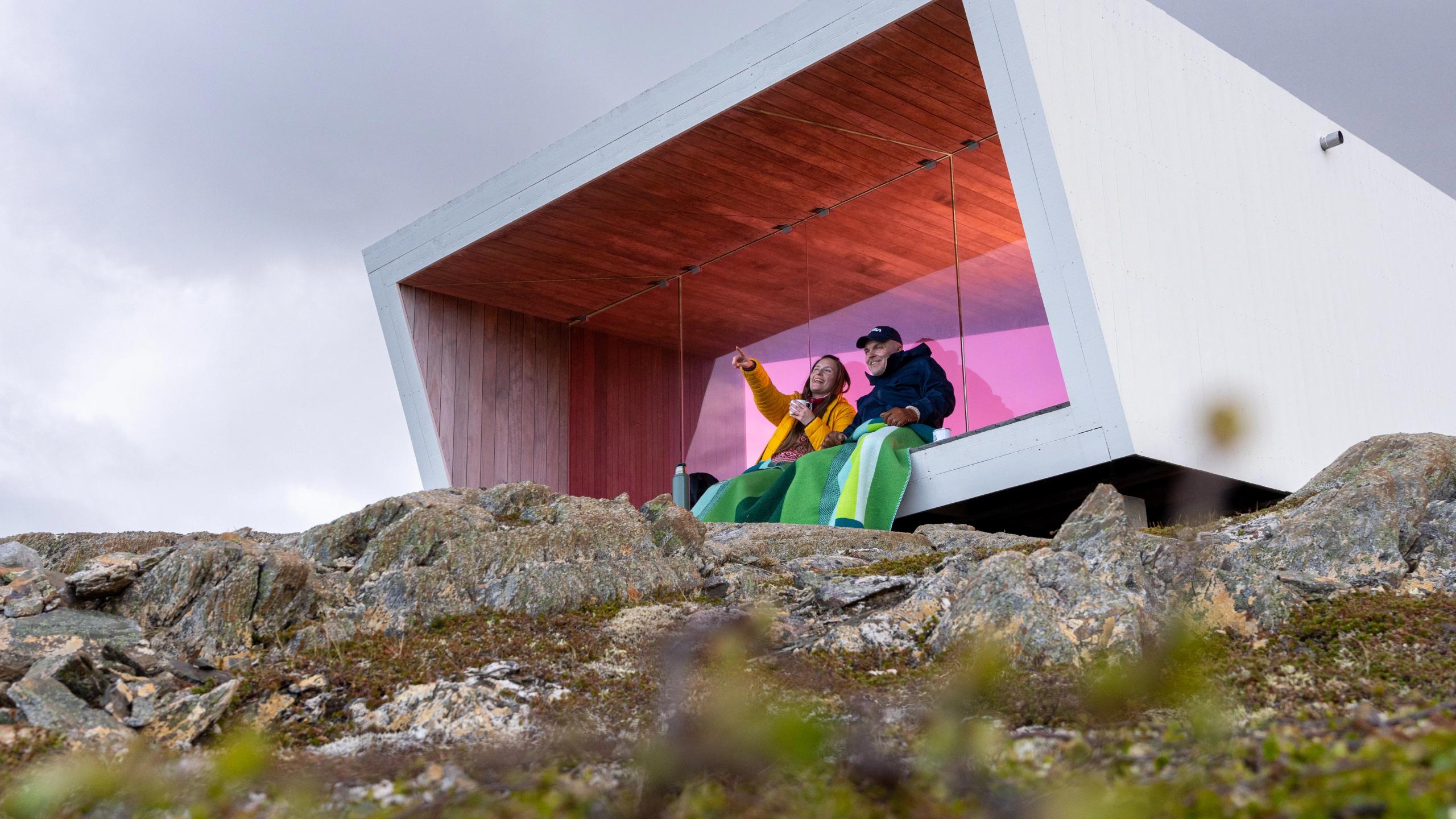 Two poeple sitting in Domen viewpoint by Biptope in Varanger, Northern Norway