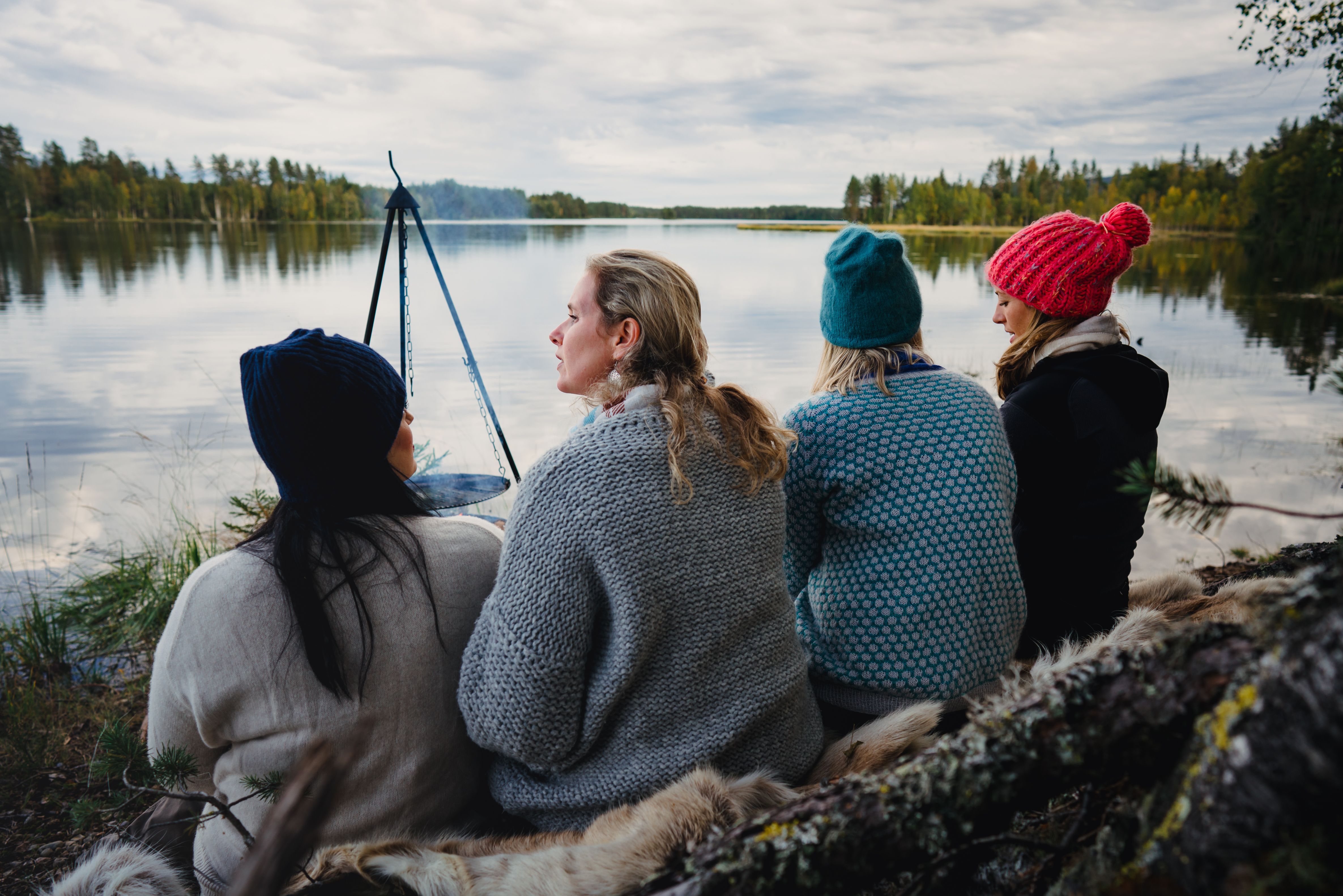 Four women are relaxing by the lake in the Finnskogen forest, Eastern Norway