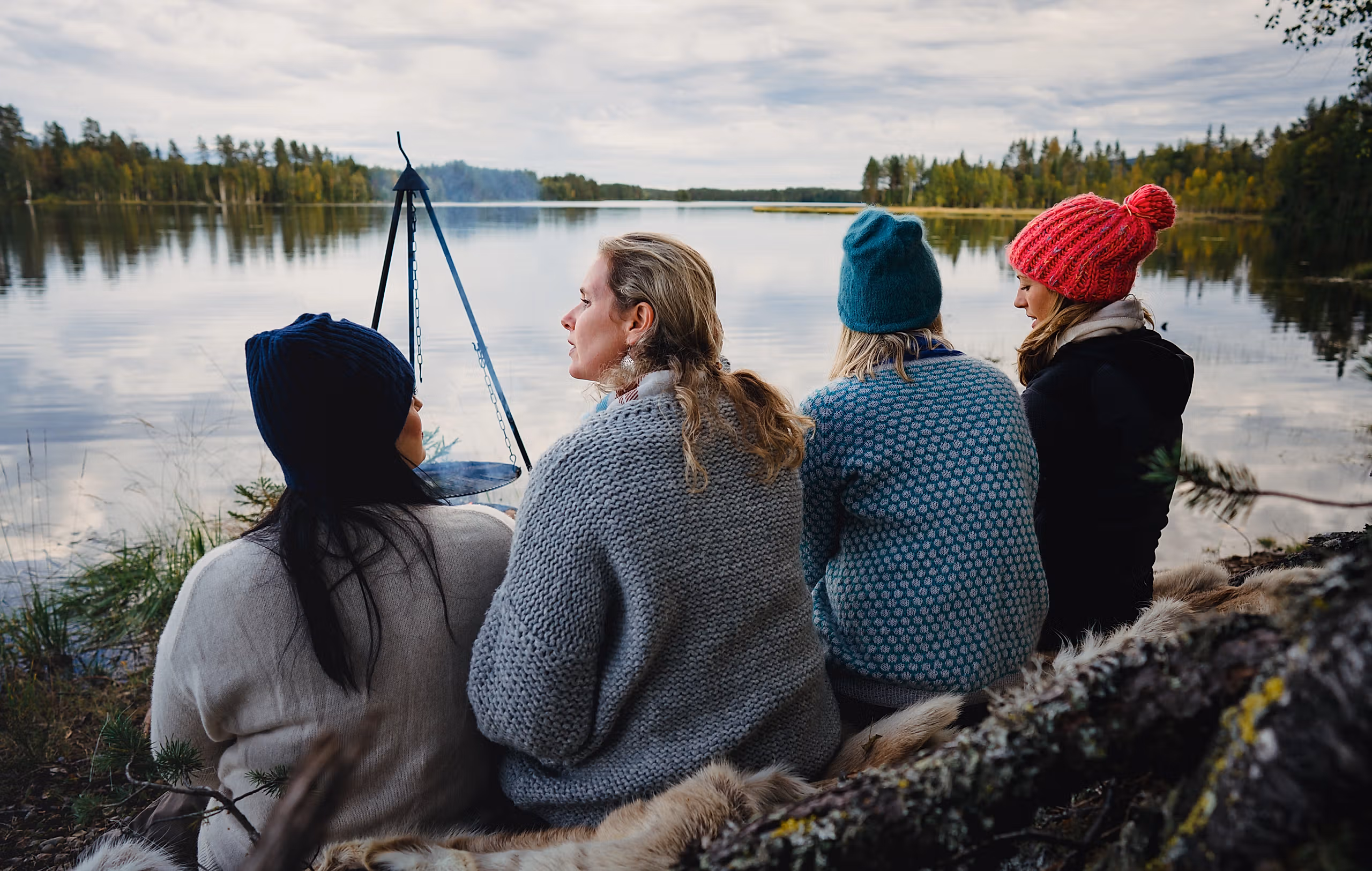Four women are relaxing by the lake in the Finnskogen forest, Eastern Norway
