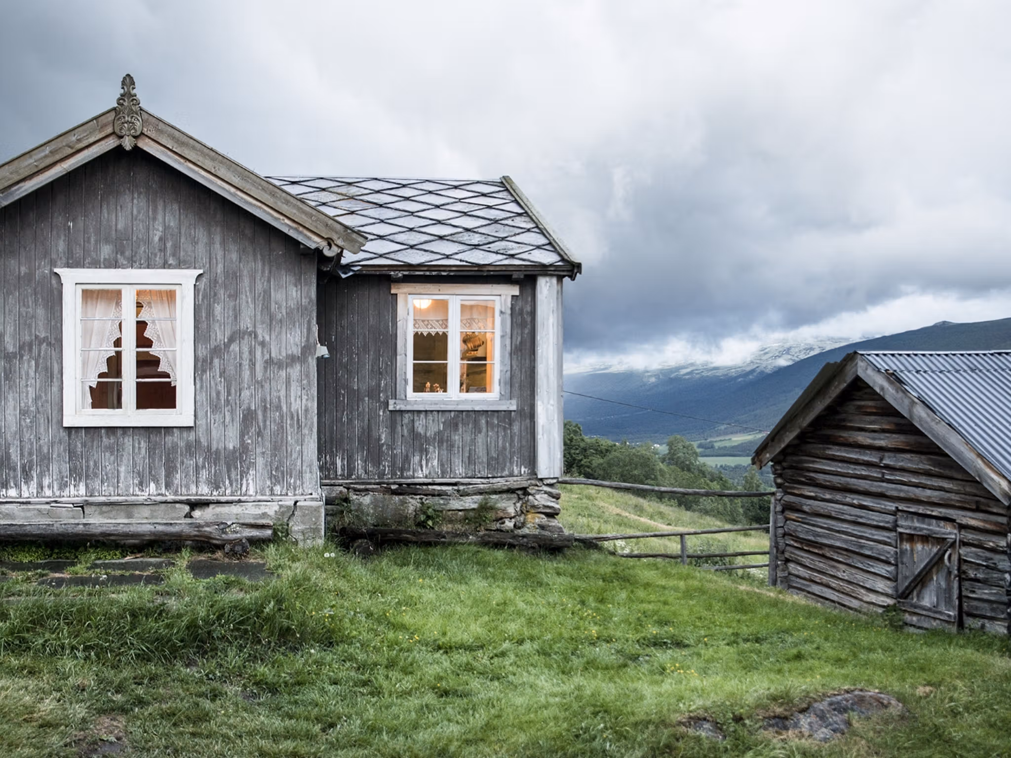 The grey houses of the farm Budsjord in the Gudbrandsdalen valley, Norway