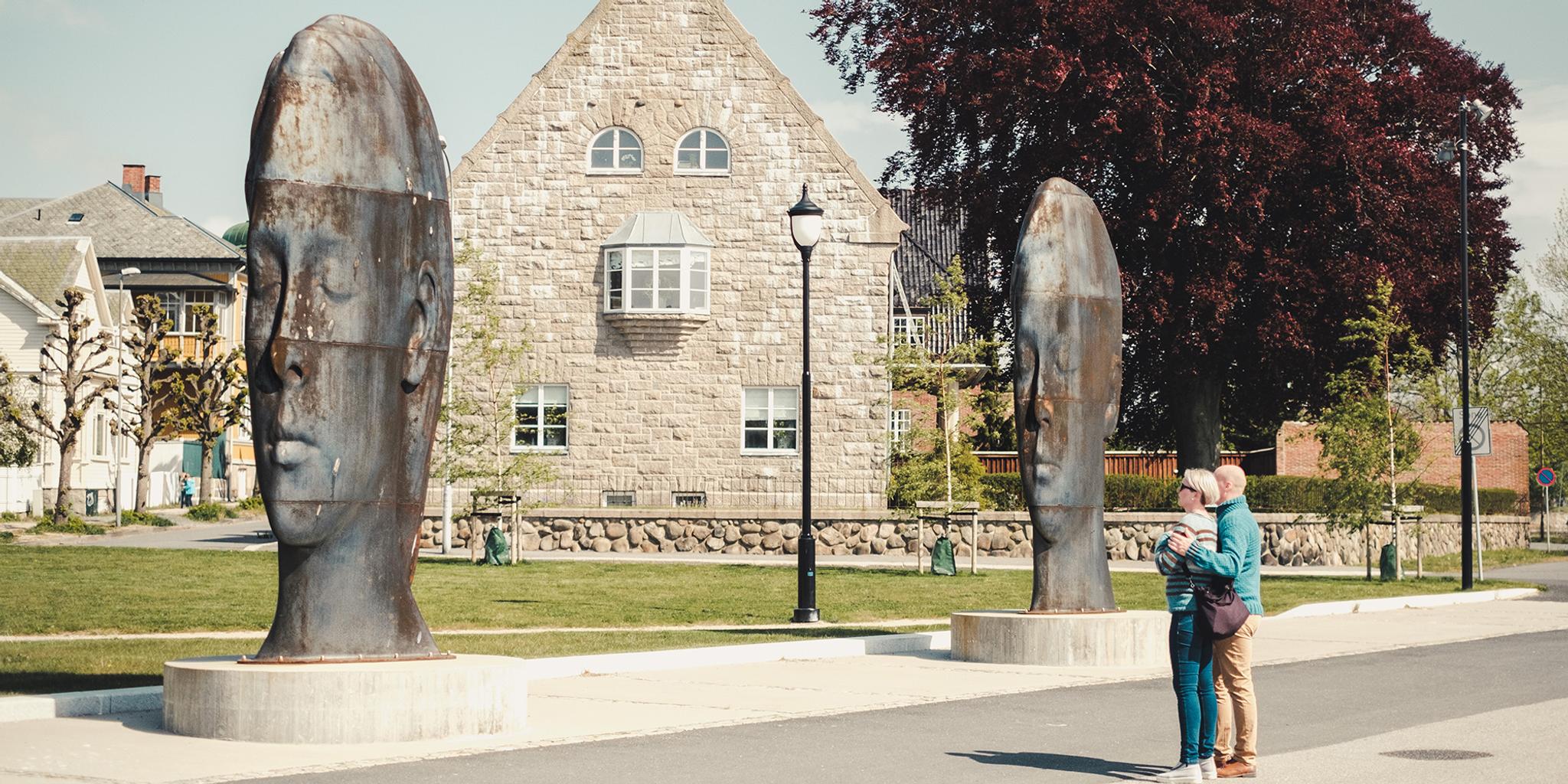 Couple looking at sculptures in Fredrikstad, Eastern Norway