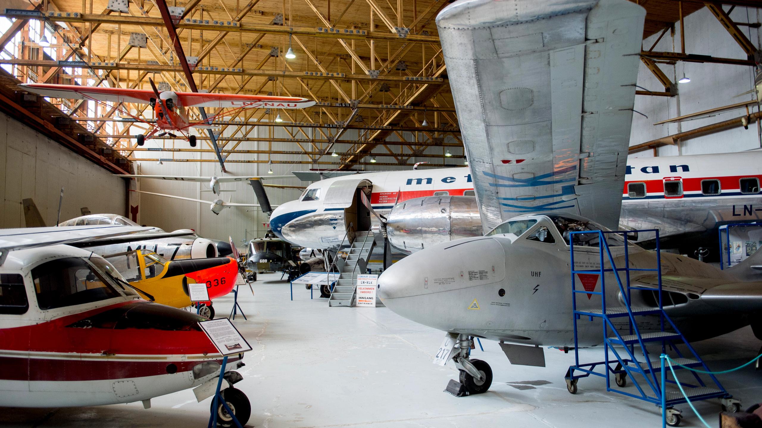 Several planes in the hangar at the museum of aviation history at Sola airport