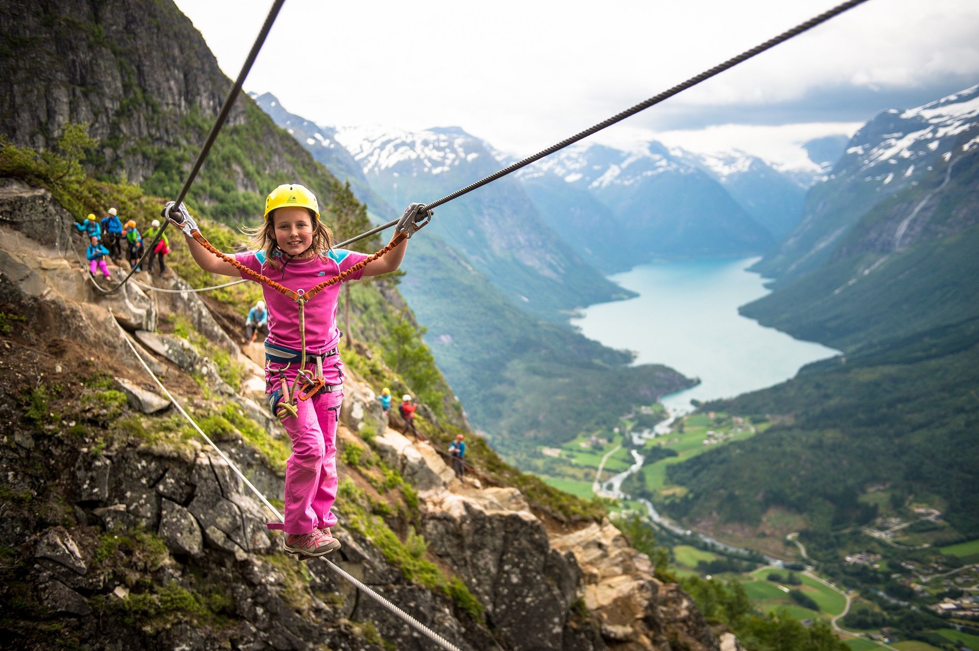 Girl climbing Loen Via Ferrata in Fjord Norway