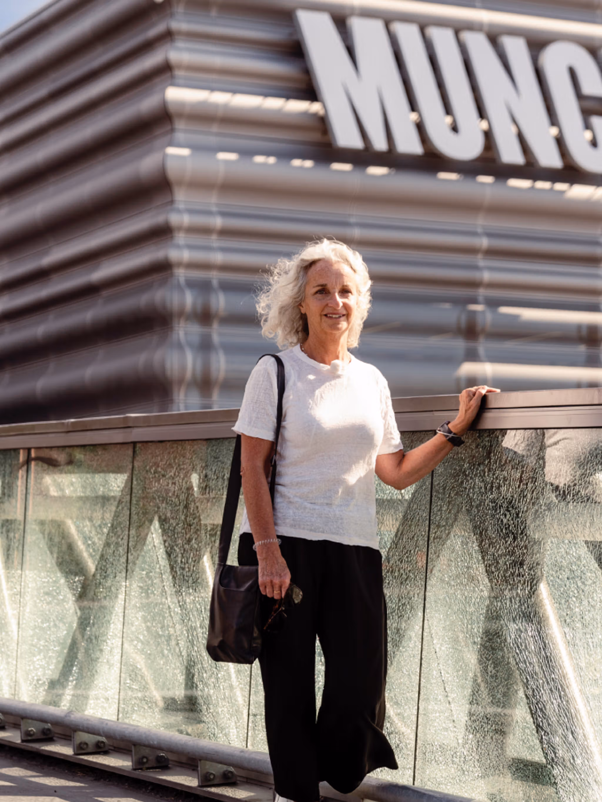 A woman walks past the MUNCH museum