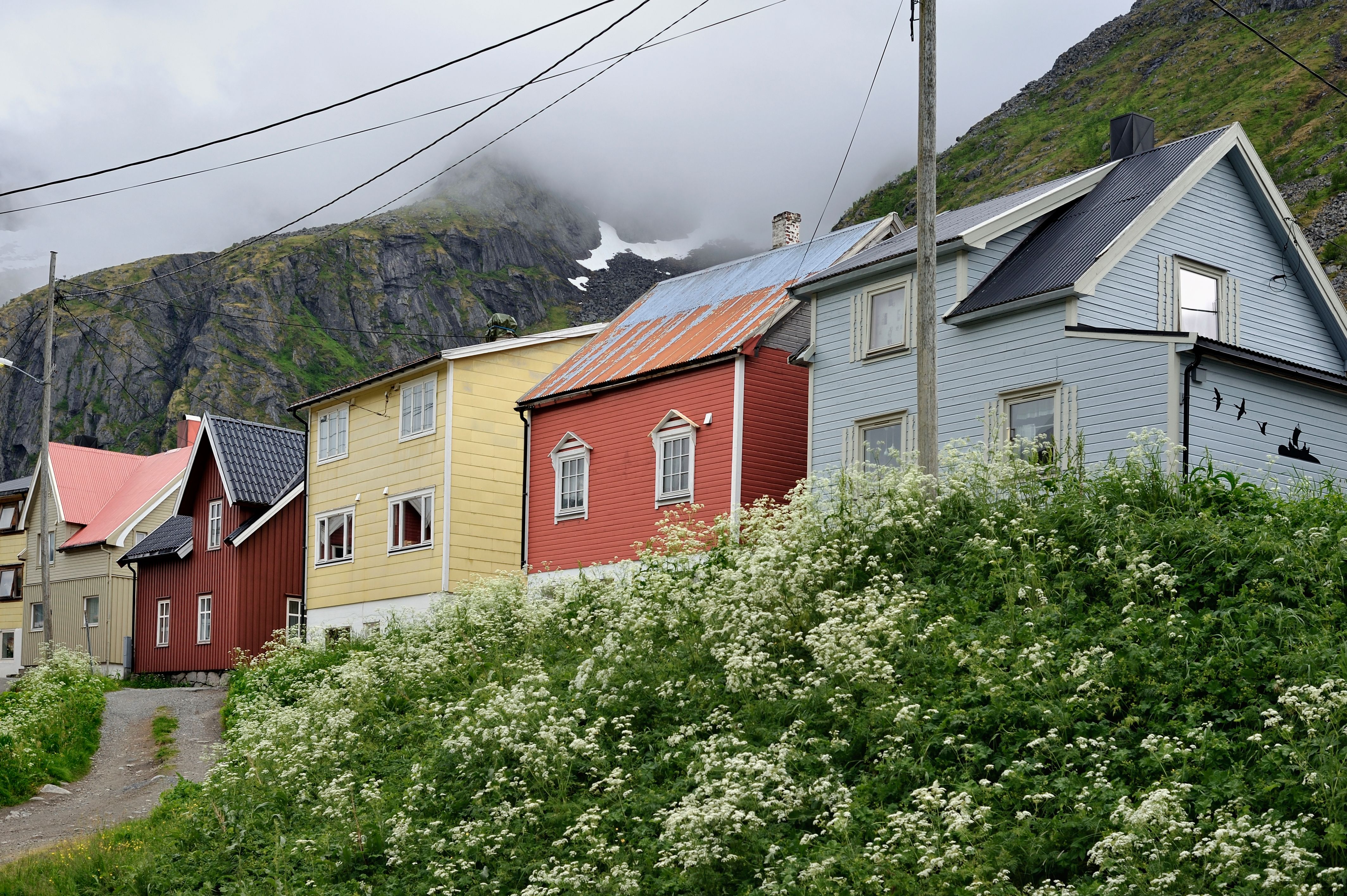 Little wooden houses at the foot of the mountains