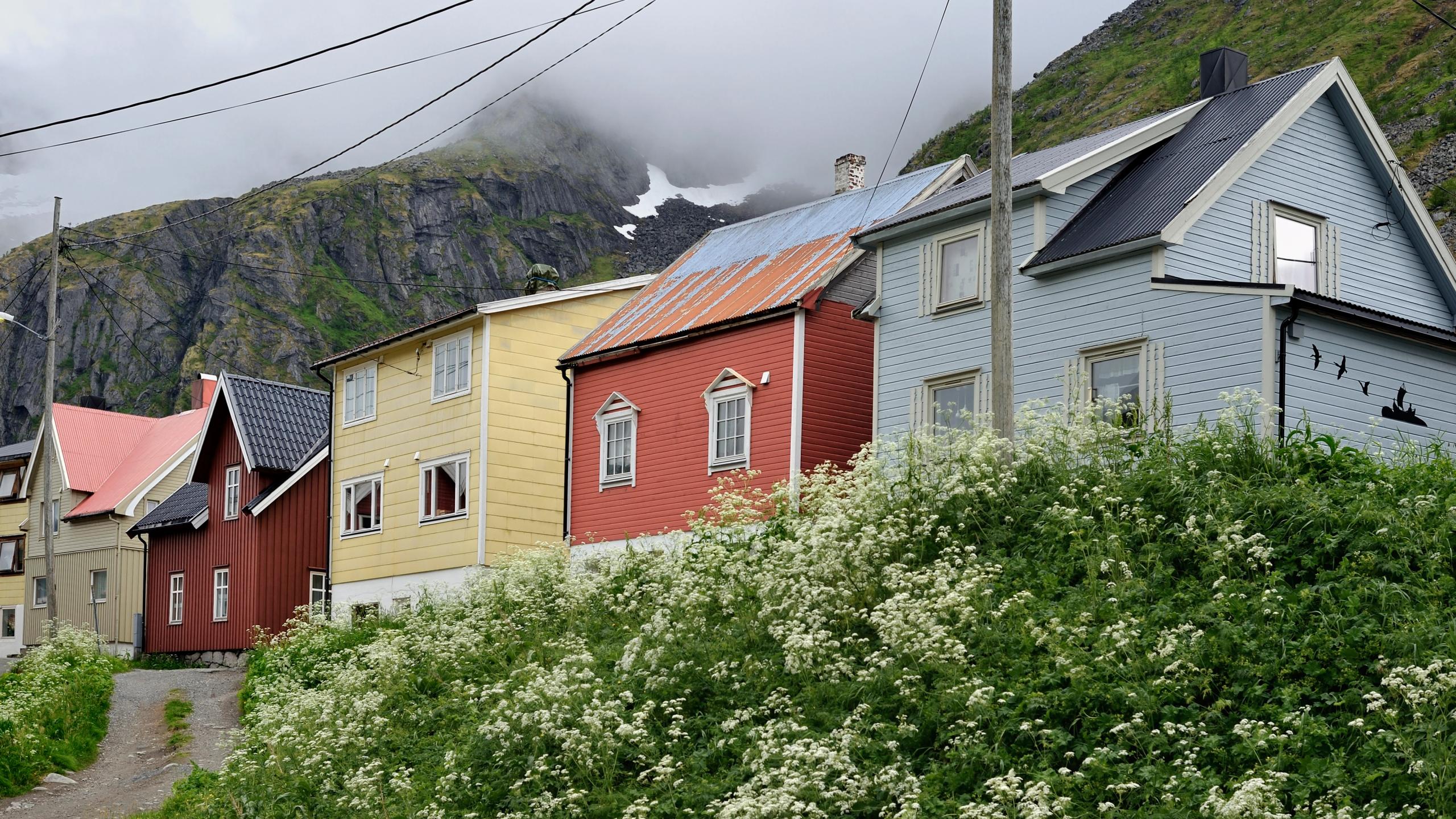 Little wooden houses at the foot of the mountains