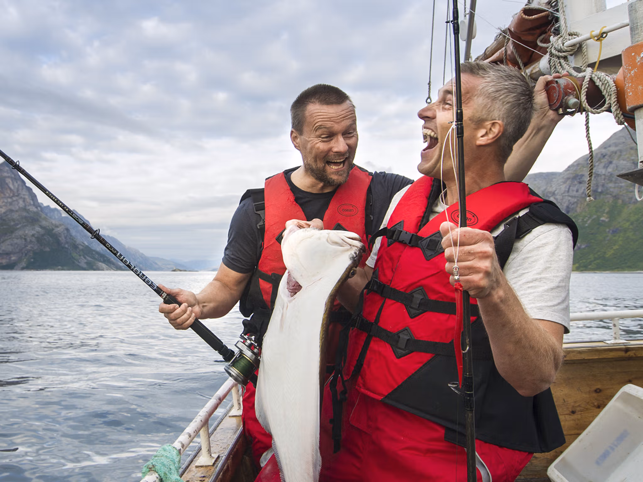 Two men in a boat sea fishing in Tromsø in Northern Norway