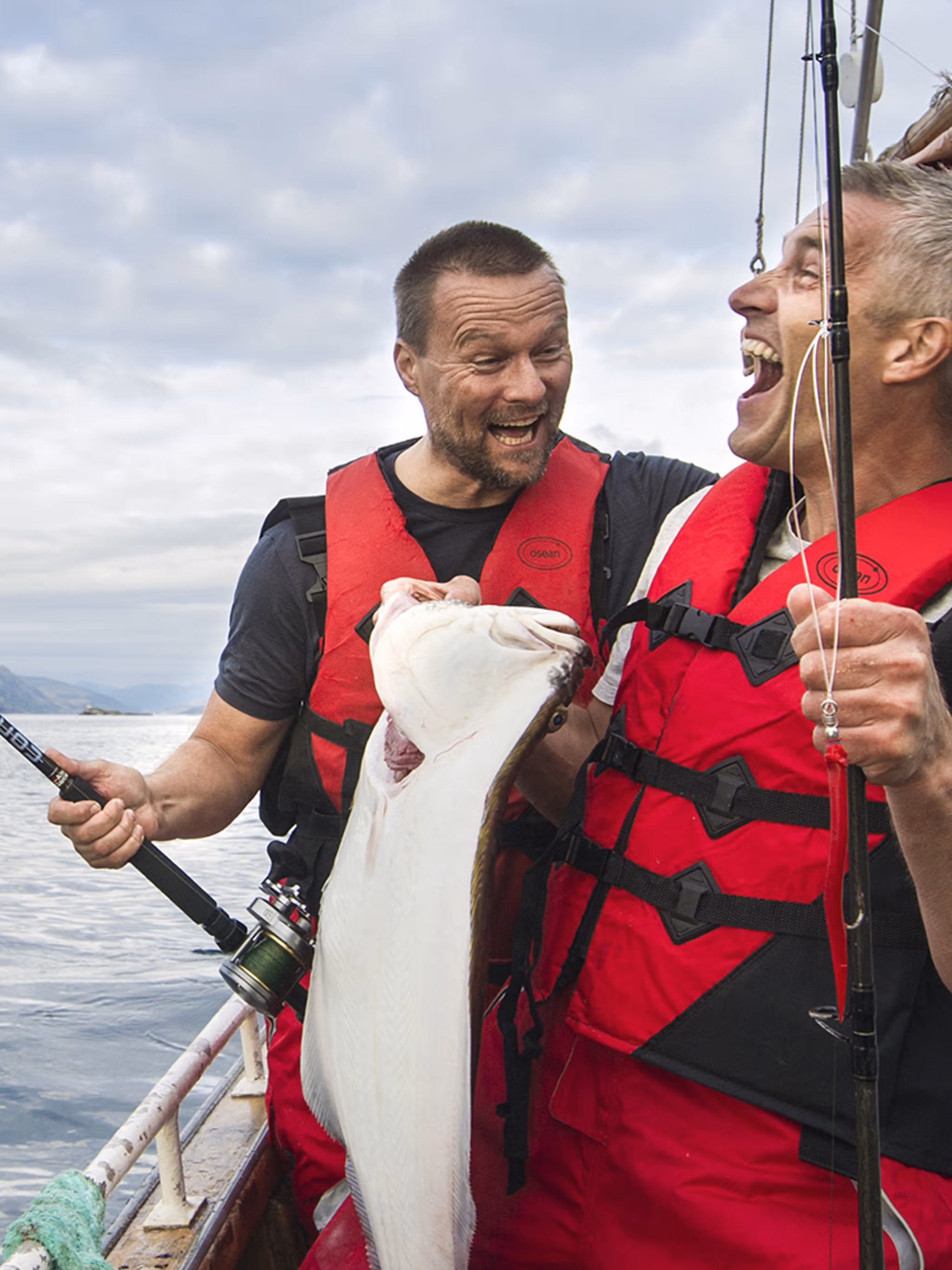 Two men in a boat sea fishing in Tromsø in Northern Norway