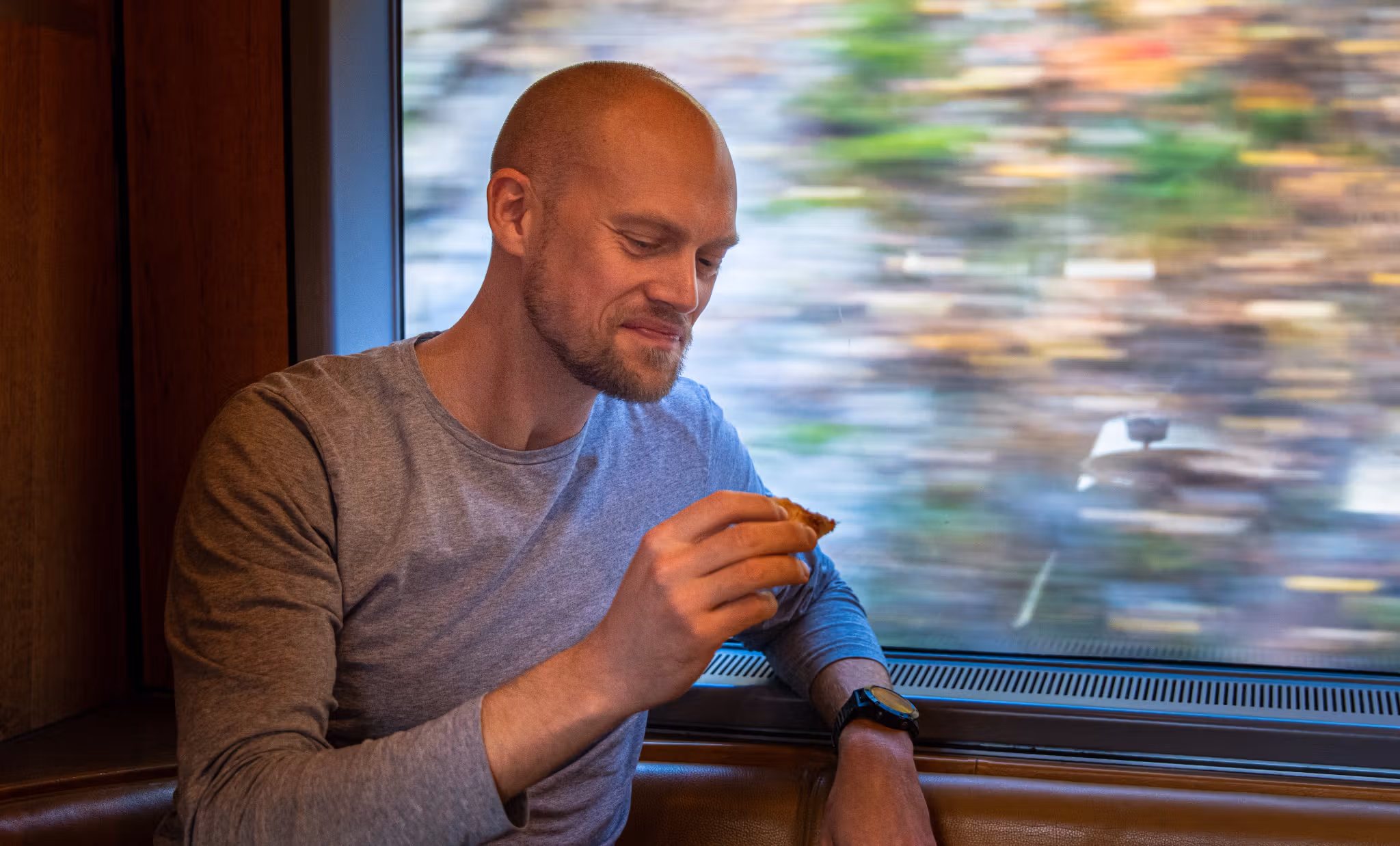 A man sitting in the cafe at the Dovre Railway