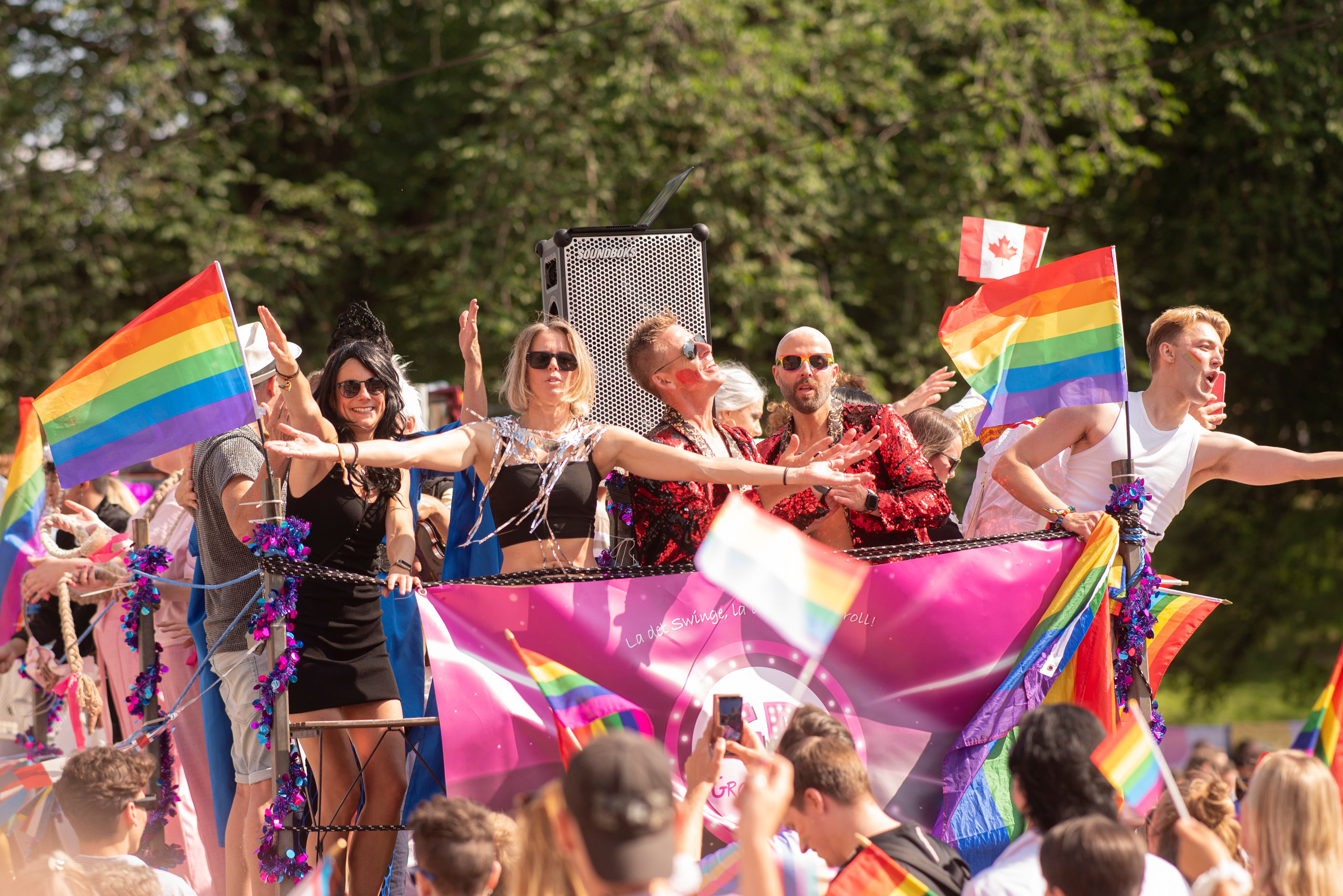 People celebrating Pride on a truck at the Oslo Pride parade, 2023
