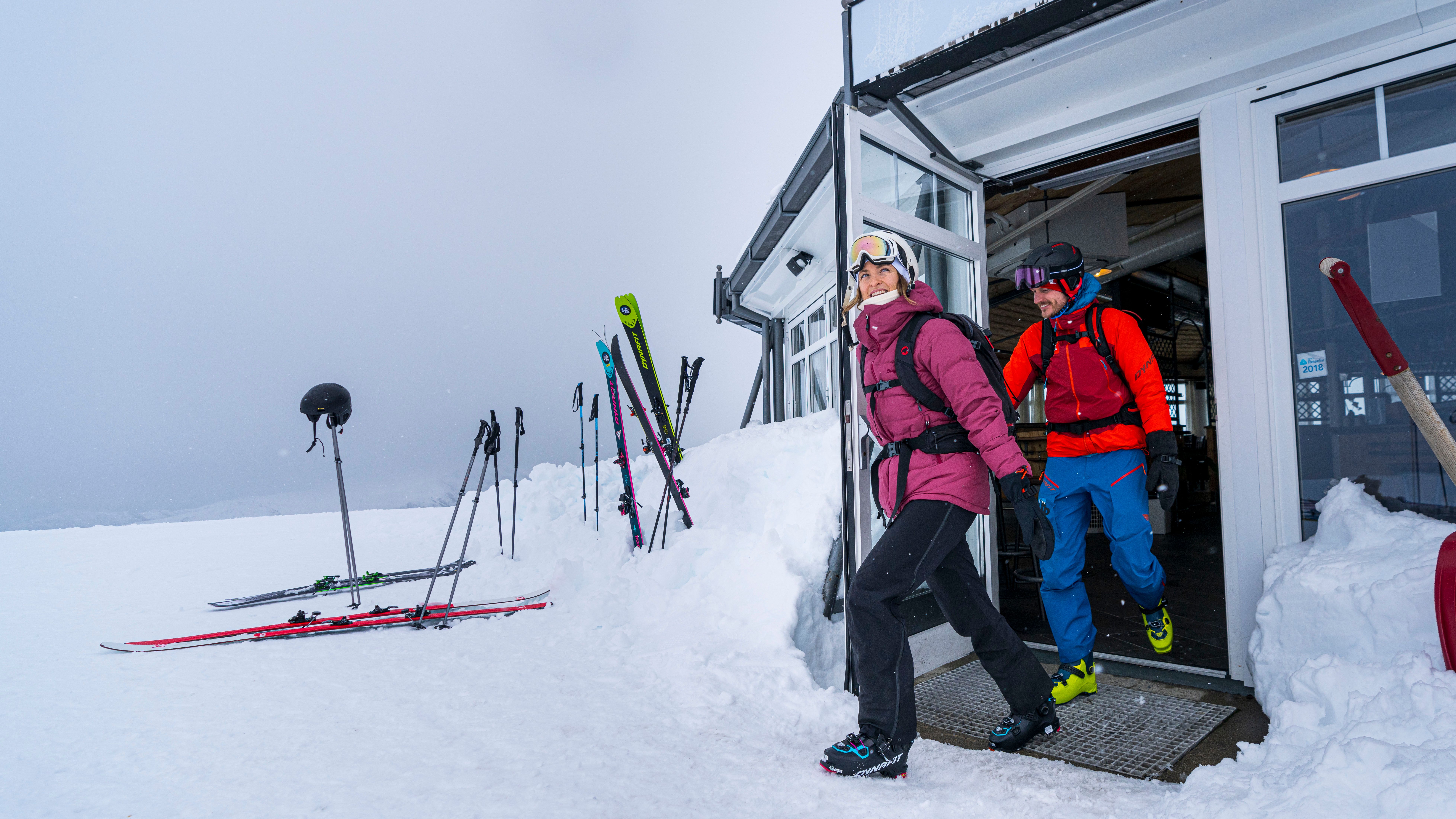Two people at the Fjord Panorama restaurant on top of Stranda Ski Resort