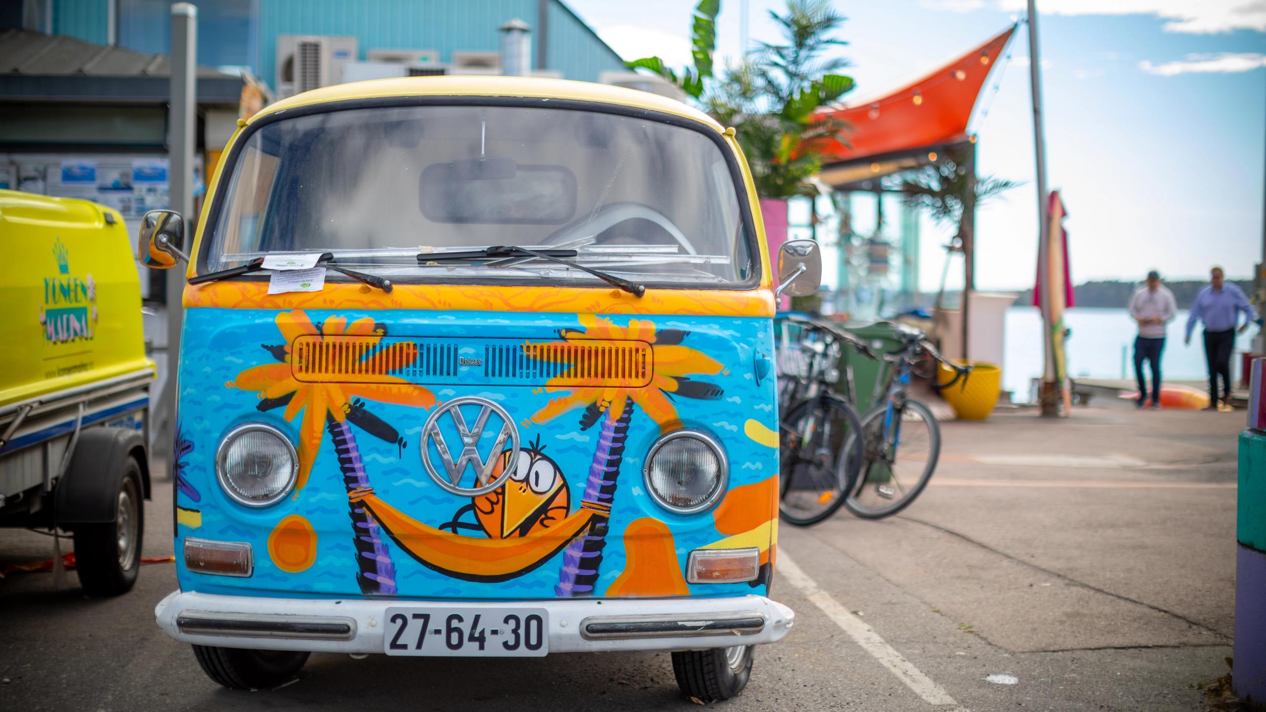 Vintage Volkswagen van with tropical paintings at Kongen Marina