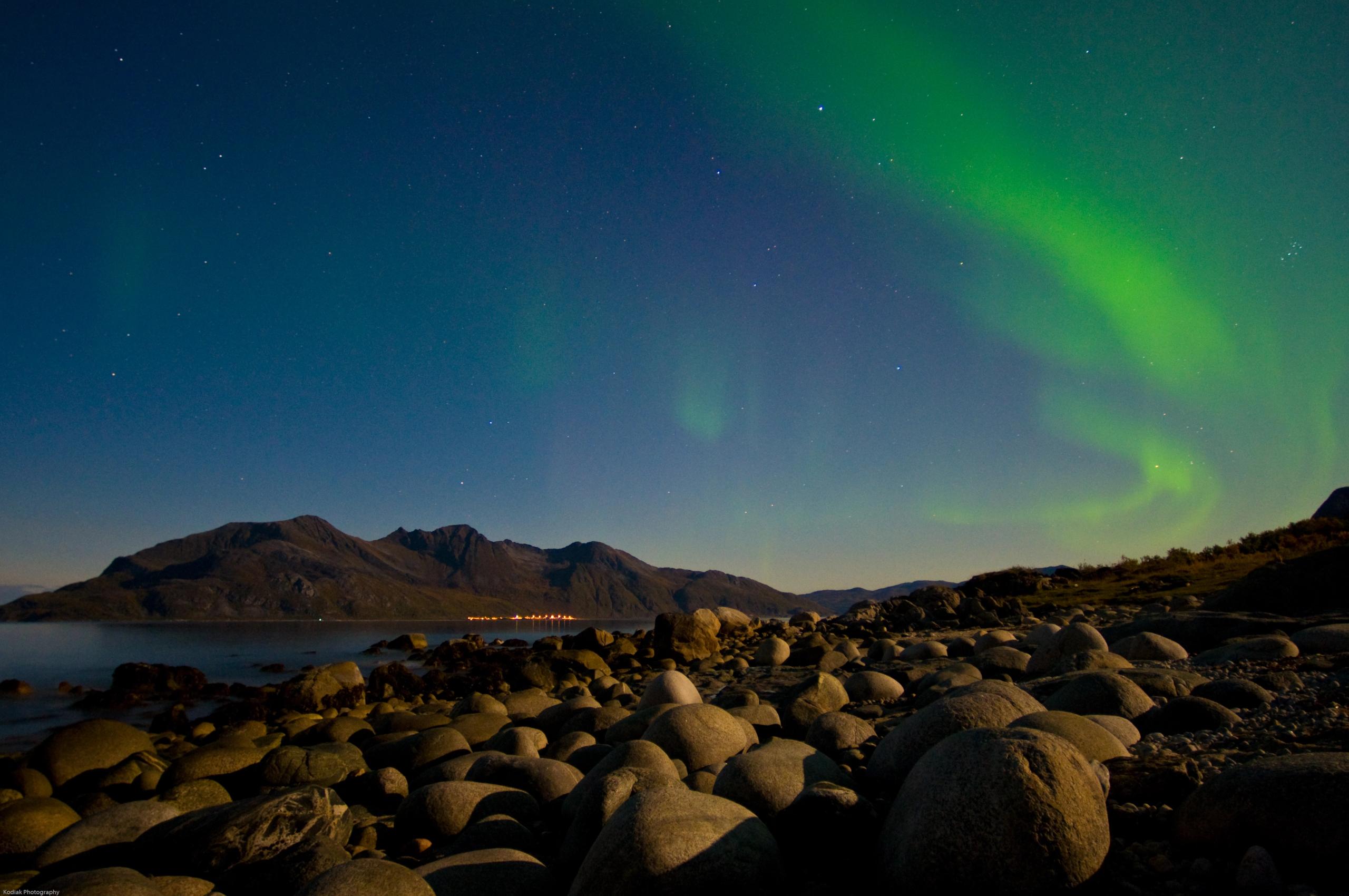 Northern lights dancing in the skies at Sommarøy