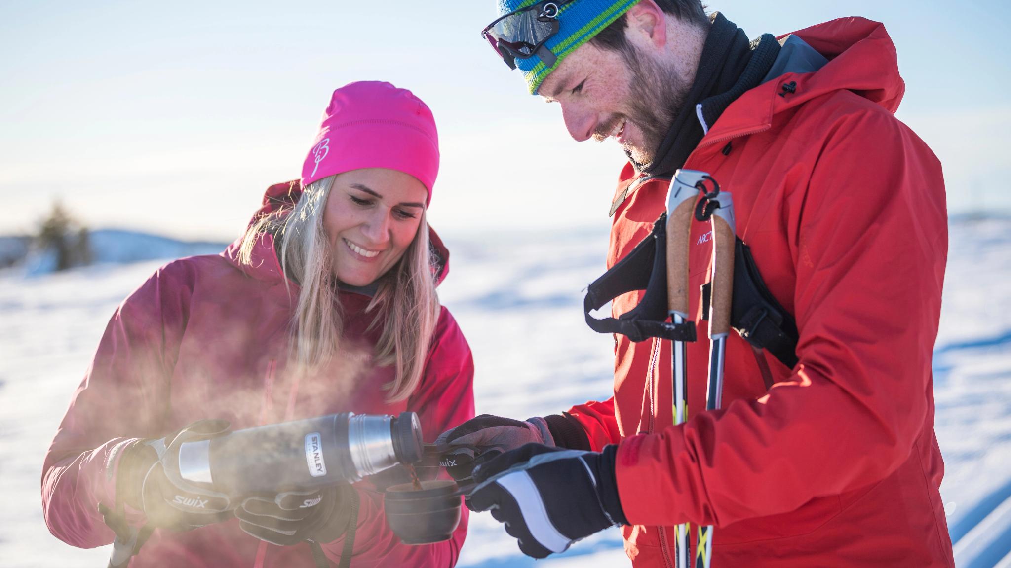 Couple enjoying a break from cross-country skiing in Valdres, Eastern Norway