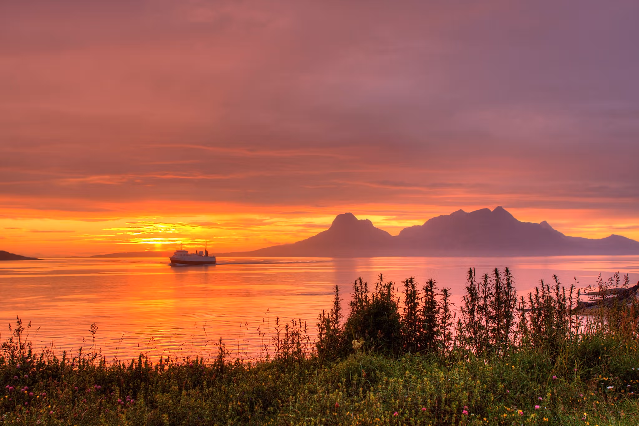 The sea under the midnight sun near Bodø, Salten, Northern Norway