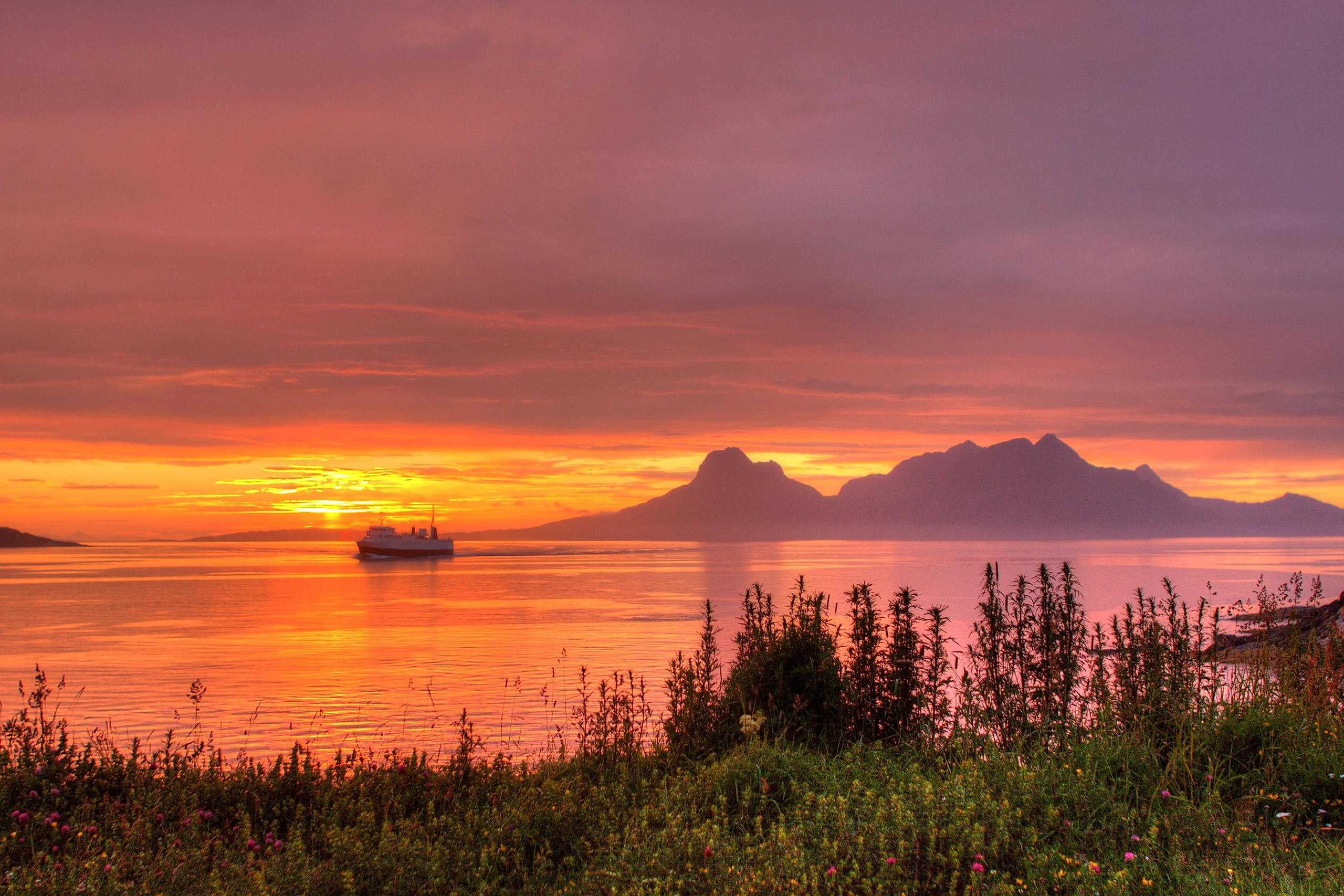 The sea under the midnight sun near Bodø, Salten, Northern Norway
