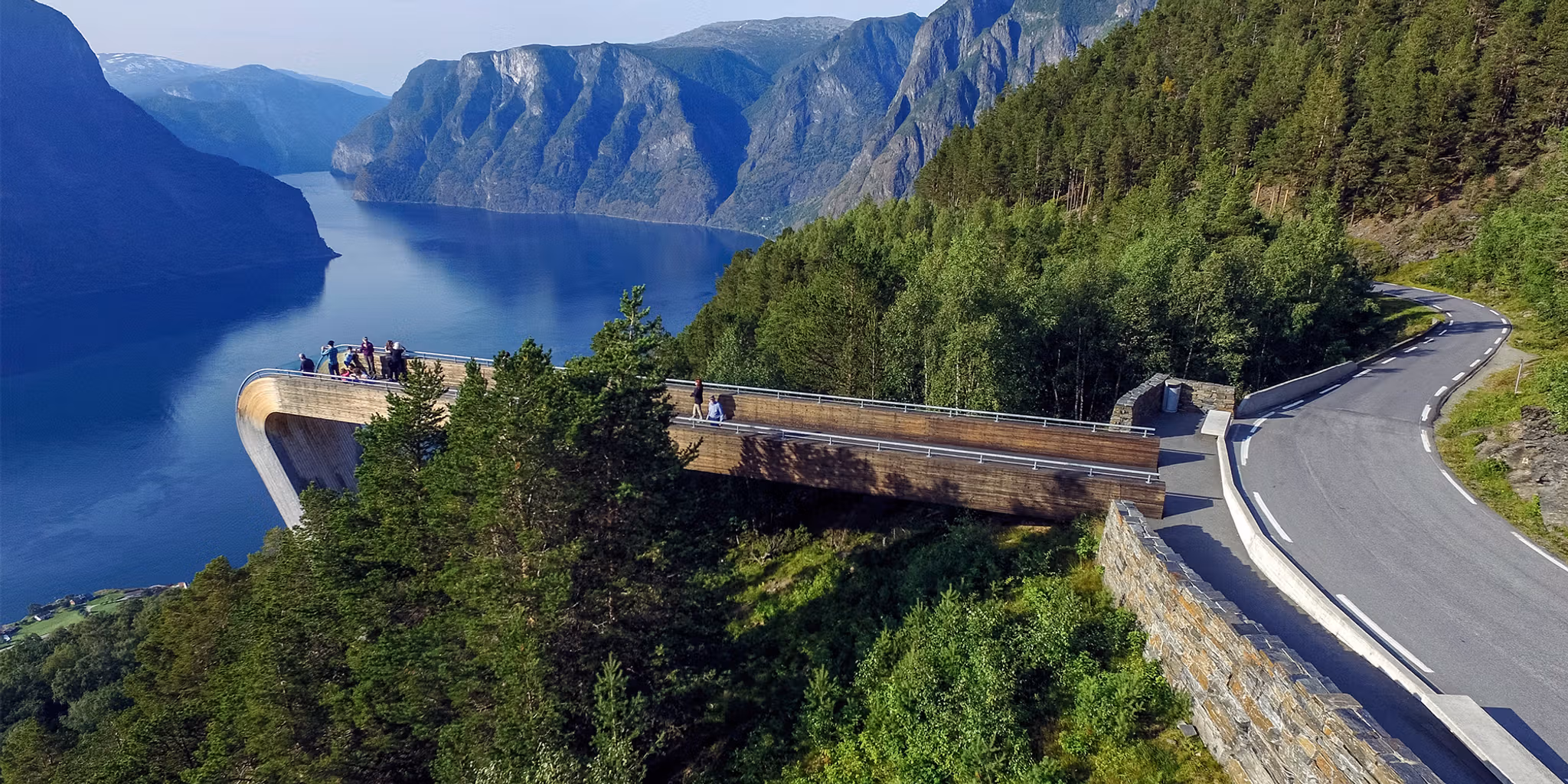 People standing at the Stegastein viewpoint along the Norwegian Scenic Route Aurlandsfjellet