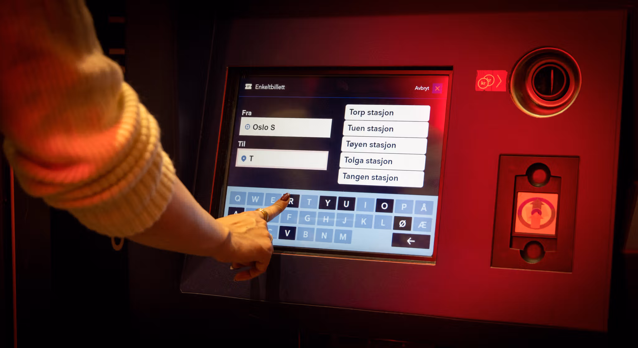 A woman buying train tickets.