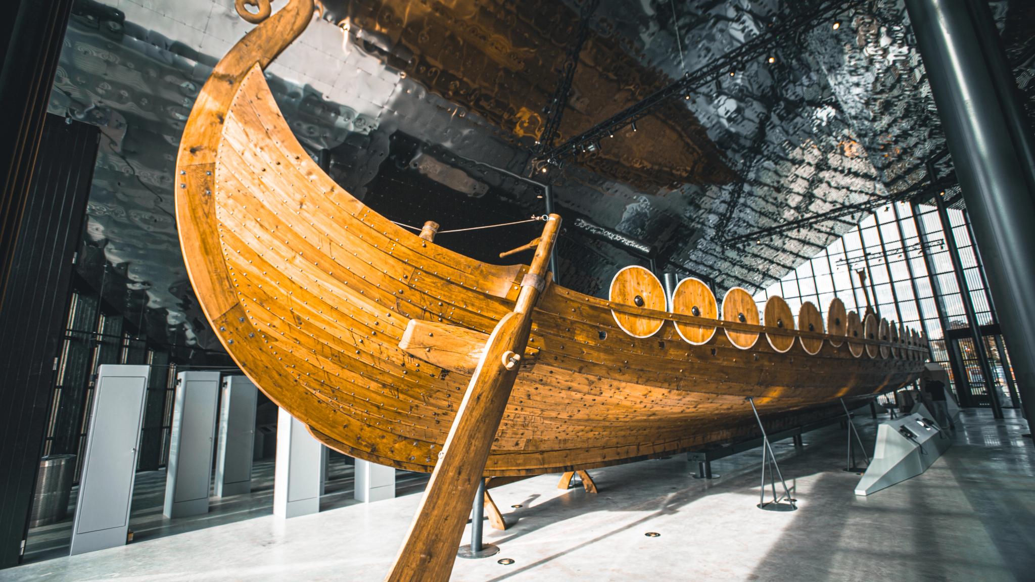 A viking ship in a museum.