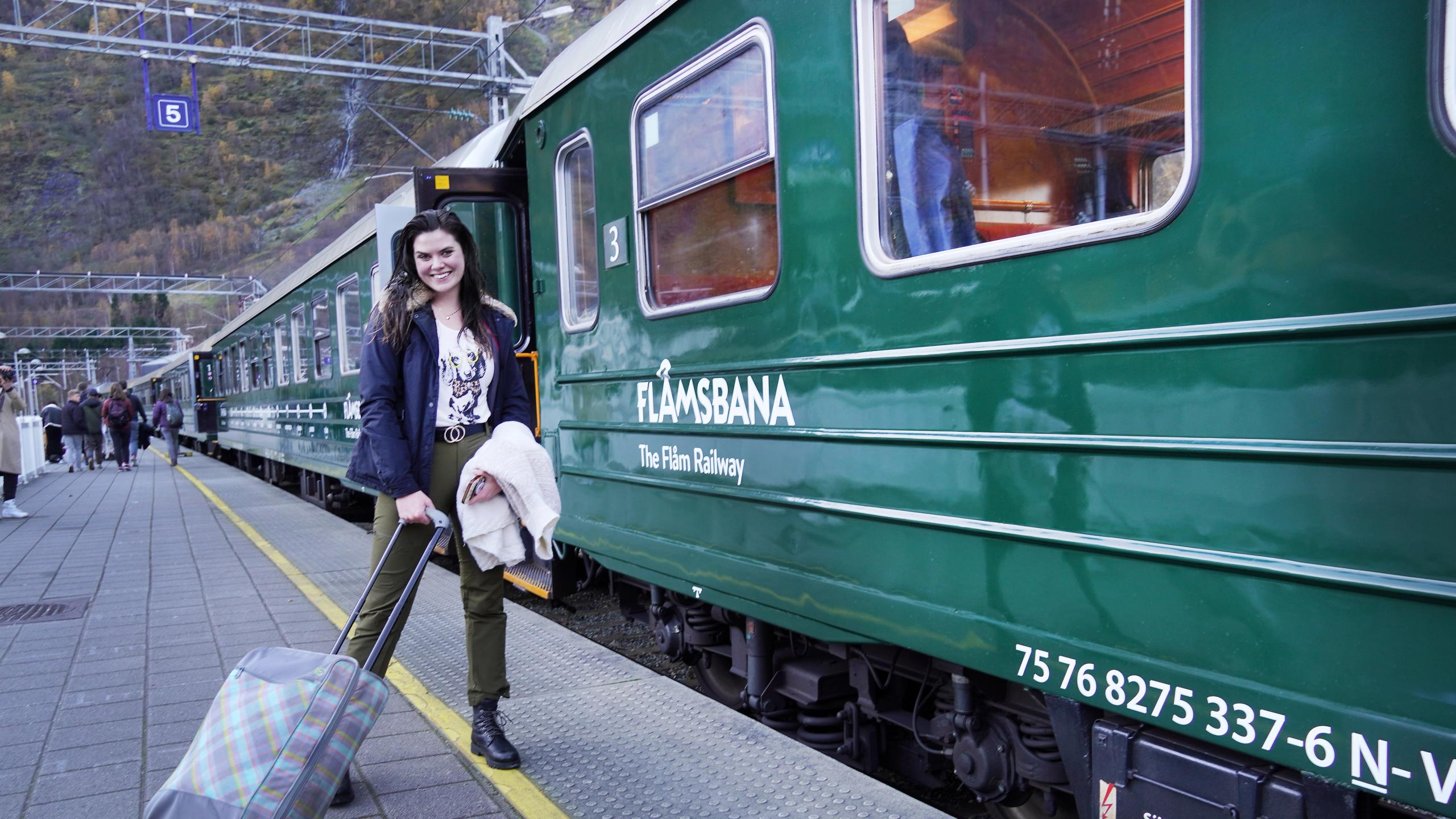 Women with a suitcase going to the flam train