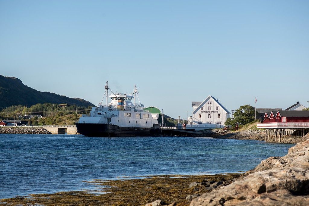 A ferry coming into a port.