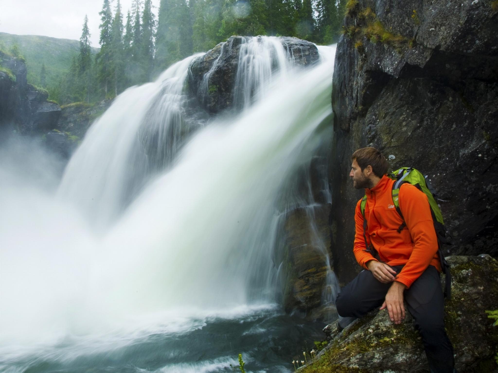 A man next to Rjukandefossen waterfall in Hemsedal, Eastern Norway