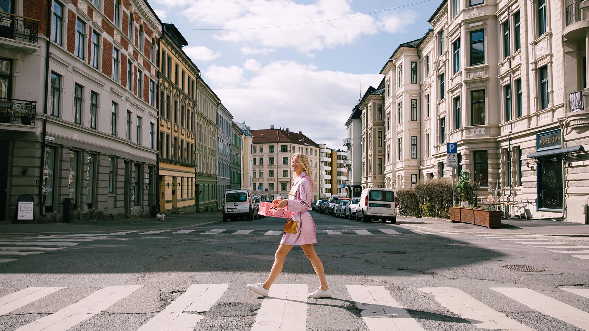 A woman with cinammon buns from Skillings in the streets of Oslo, Eastern Norway