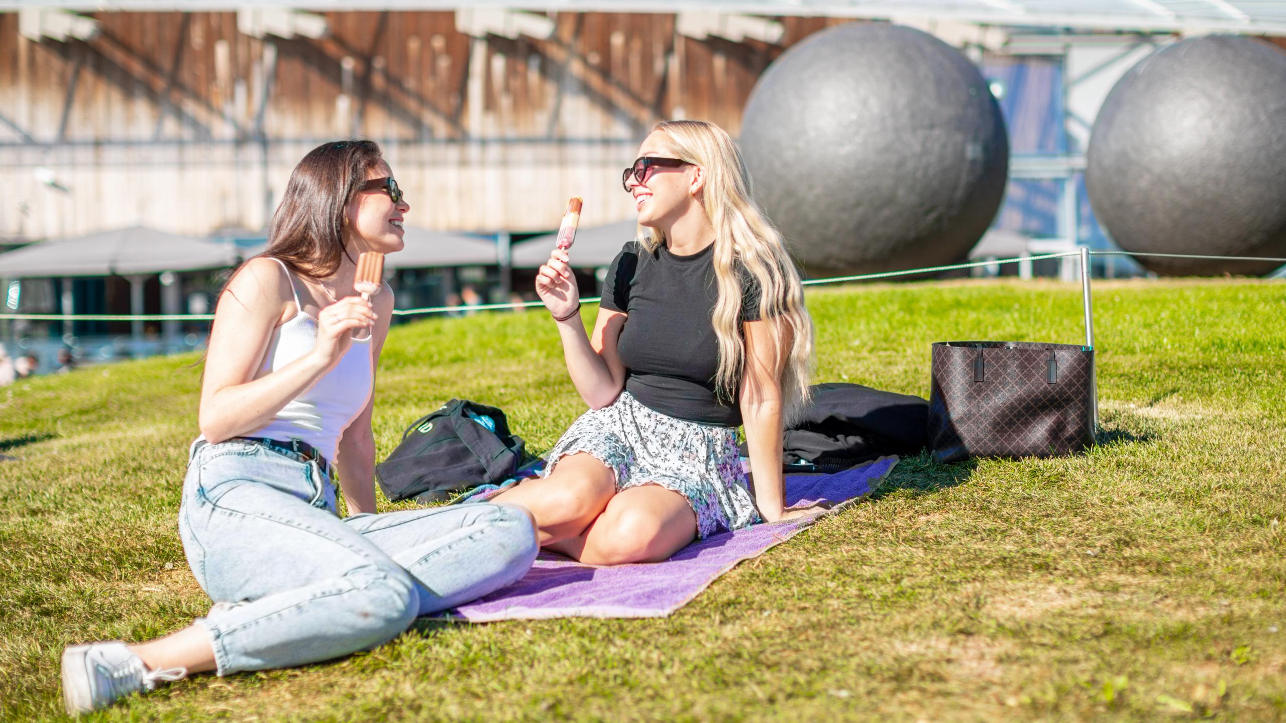 Two girls eating ice cream at Tjuvholmen