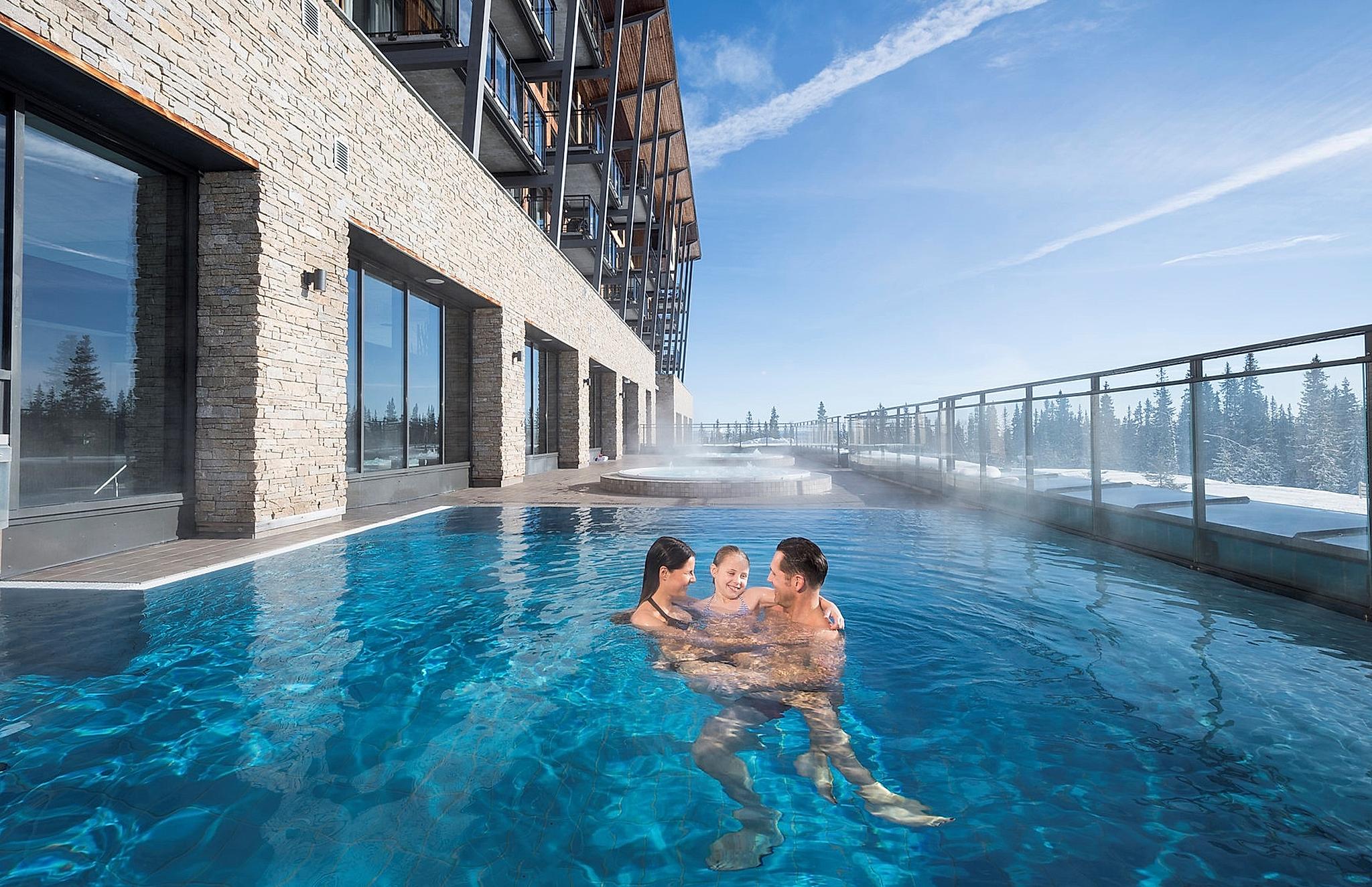 Family enjoying the pool at SkiStar Lodge Trysil