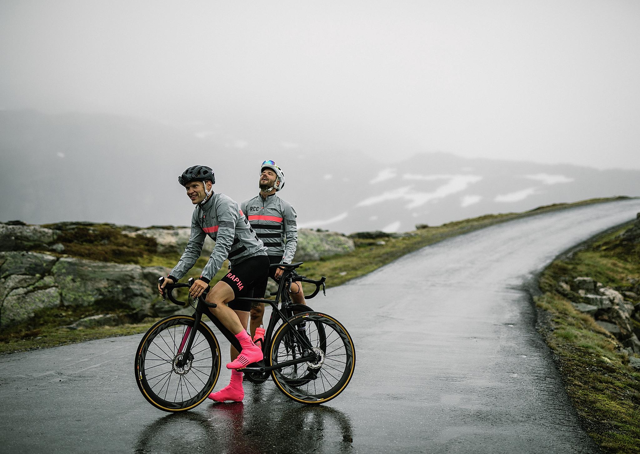 Two road cyclists on a rainy day in Fjord Norway