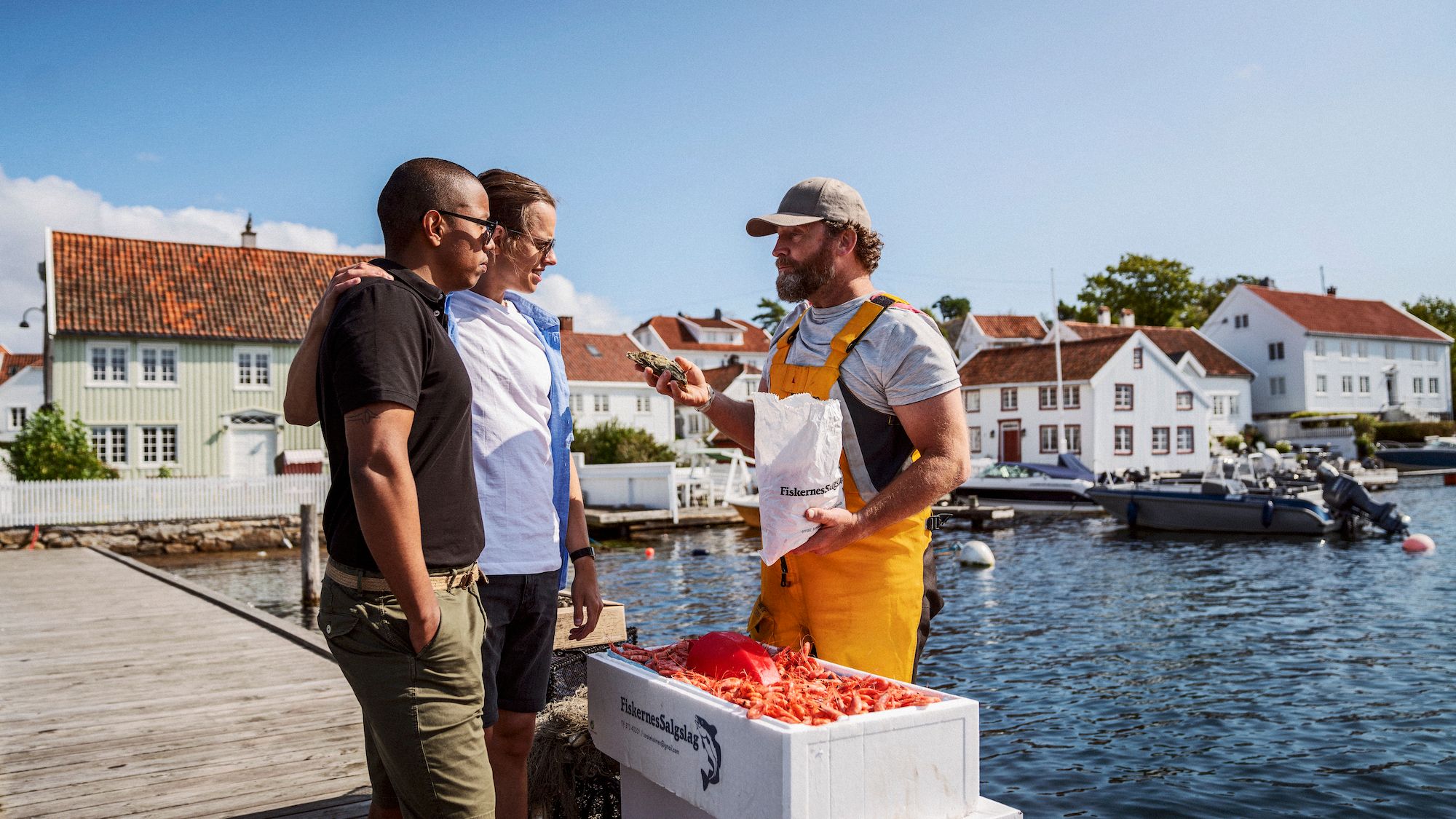 Two men buying shrimps at Brekkestø in Lillesand, Southern Norway