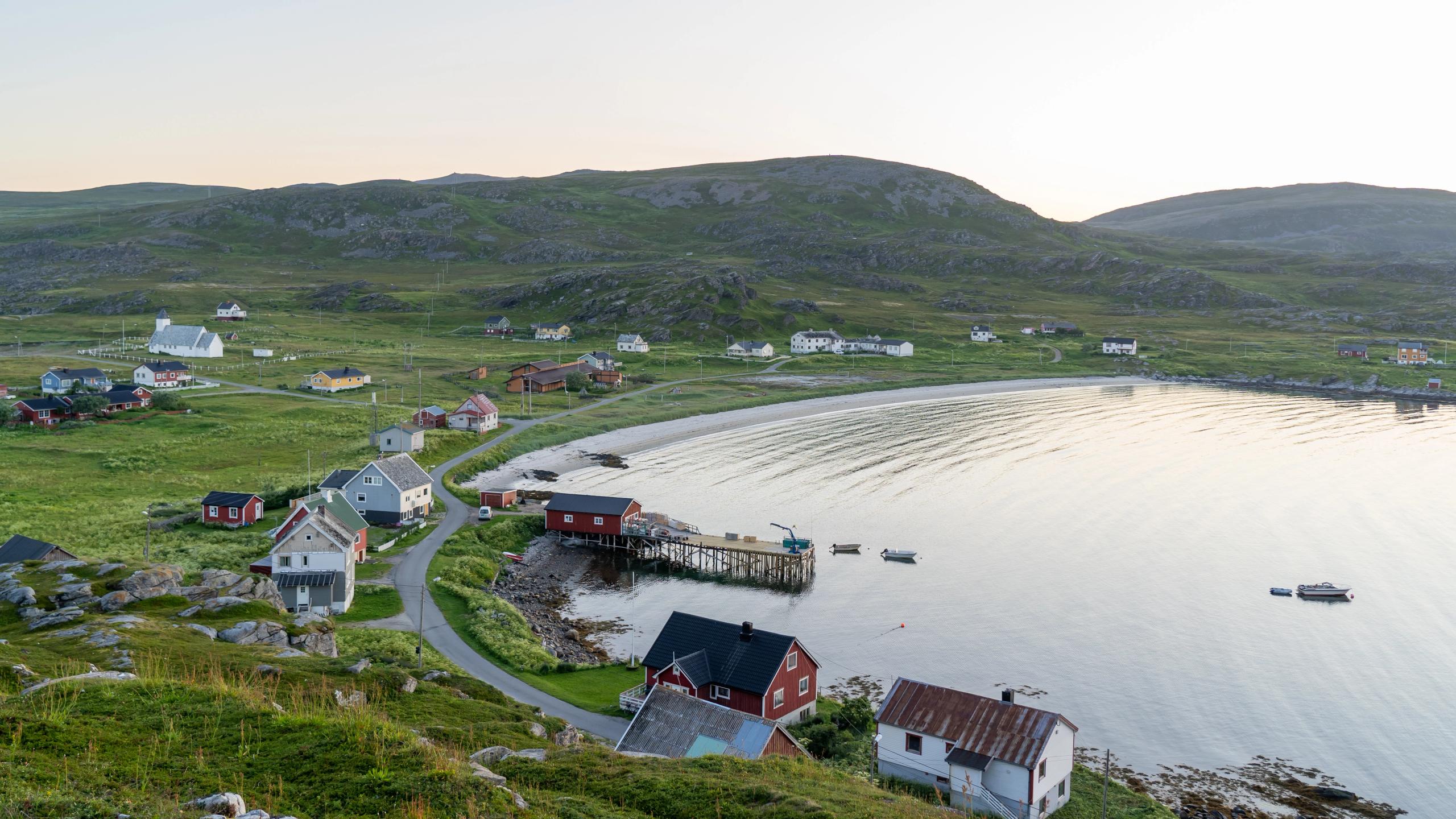 View of the landscape on Måsøya with houses and the sea