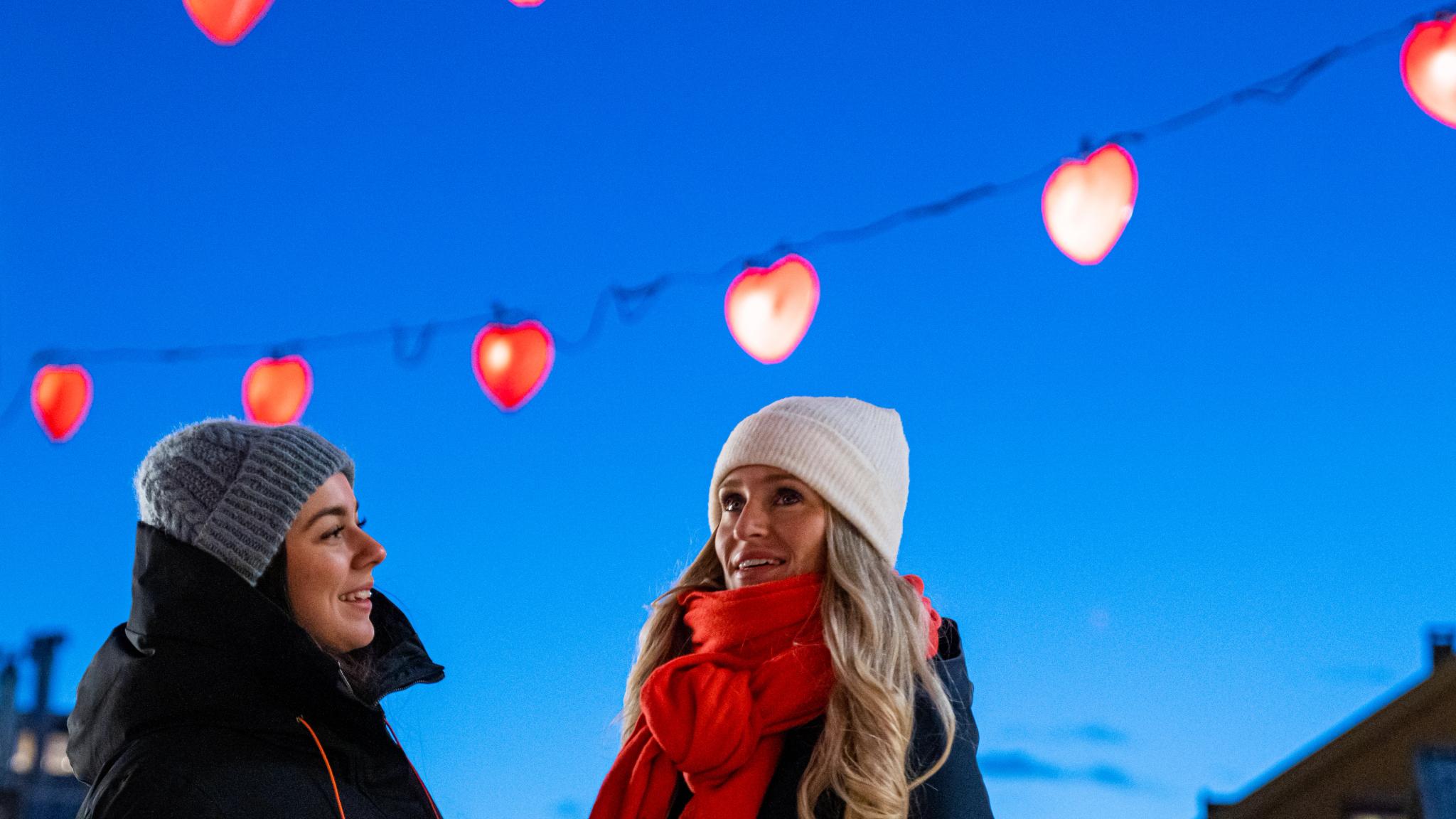Two girls in the heart street in Tromsø