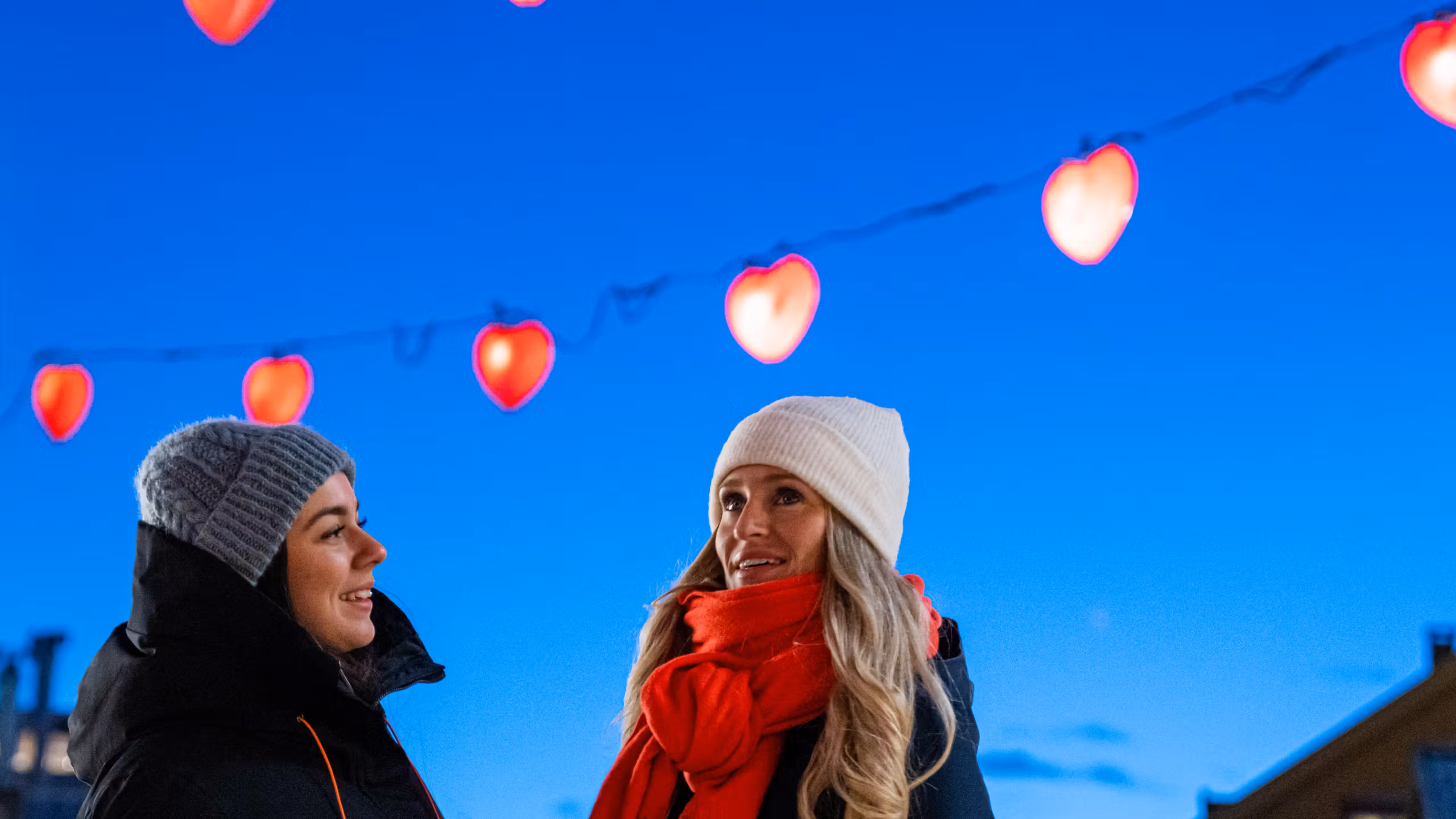Two girls in the heart street in Tromsø