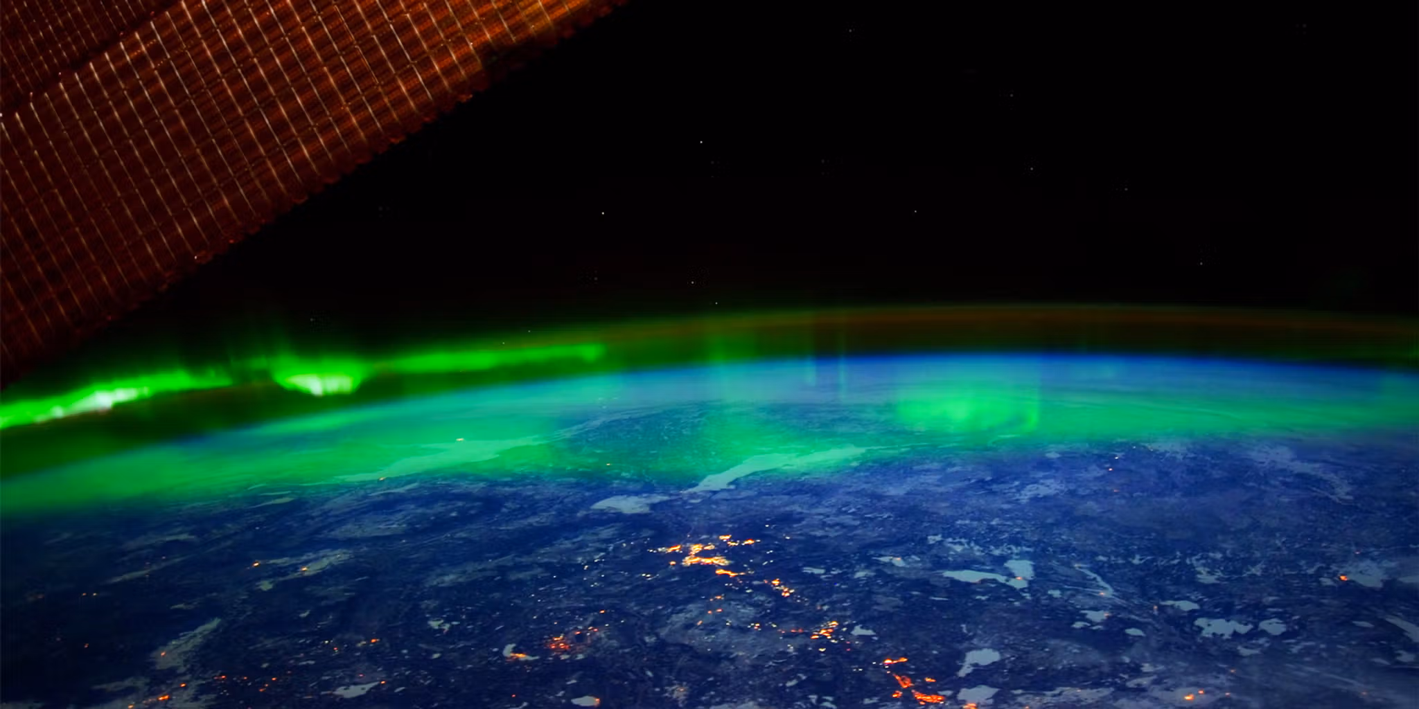 The northern lights hovering above the earth