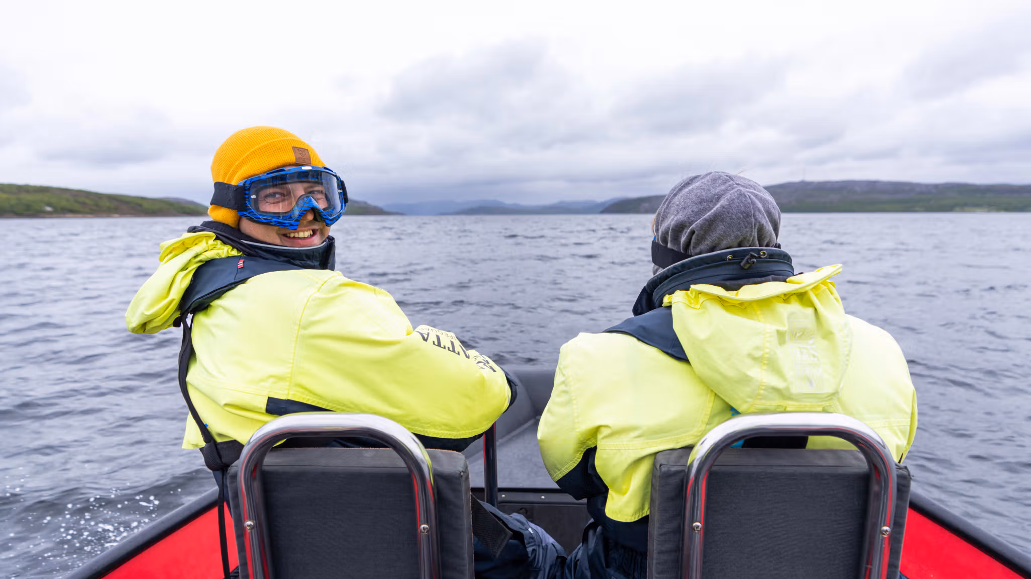 People in a RIB boat outside of Kirkenes in Northern Norway on a king crab safari.
