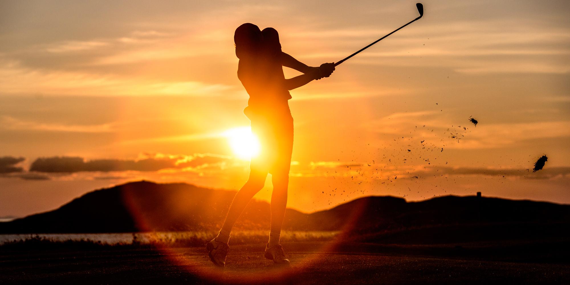 A person playing golf under the midnight sun in Bodø, Norway