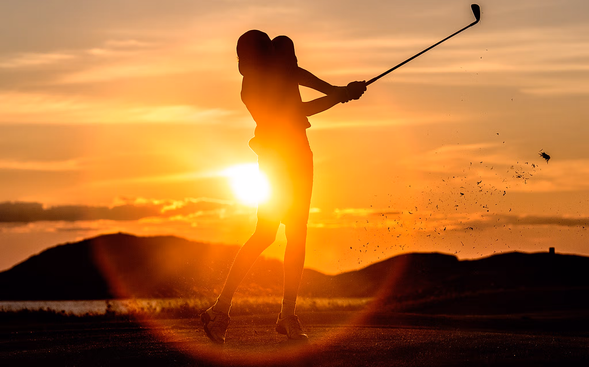 A person playing golf under the midnight sun in Bodø, Norway
