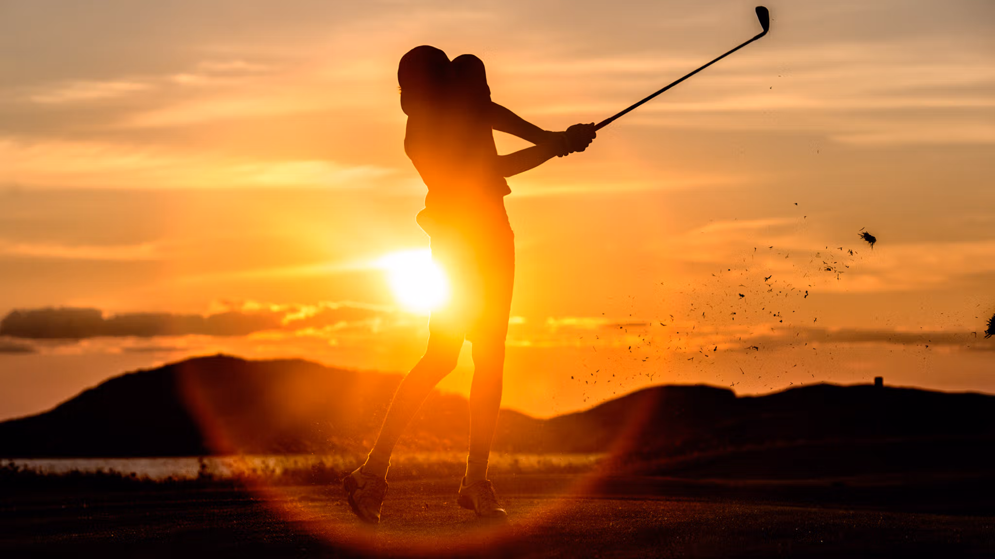 A person playing golf under the midnight sun in Bodø, Norway
