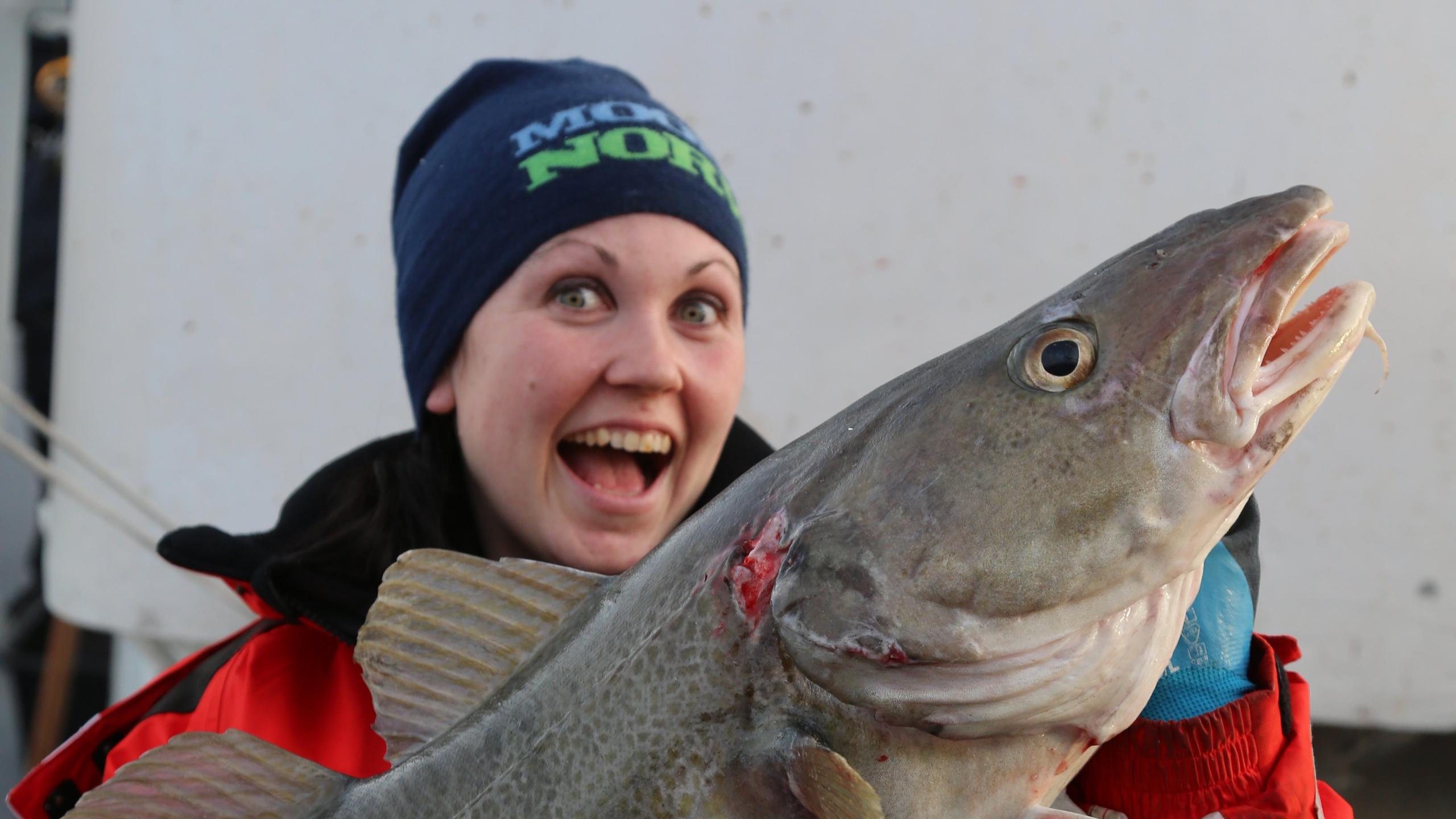 Woman fishing in Borgundfjorden