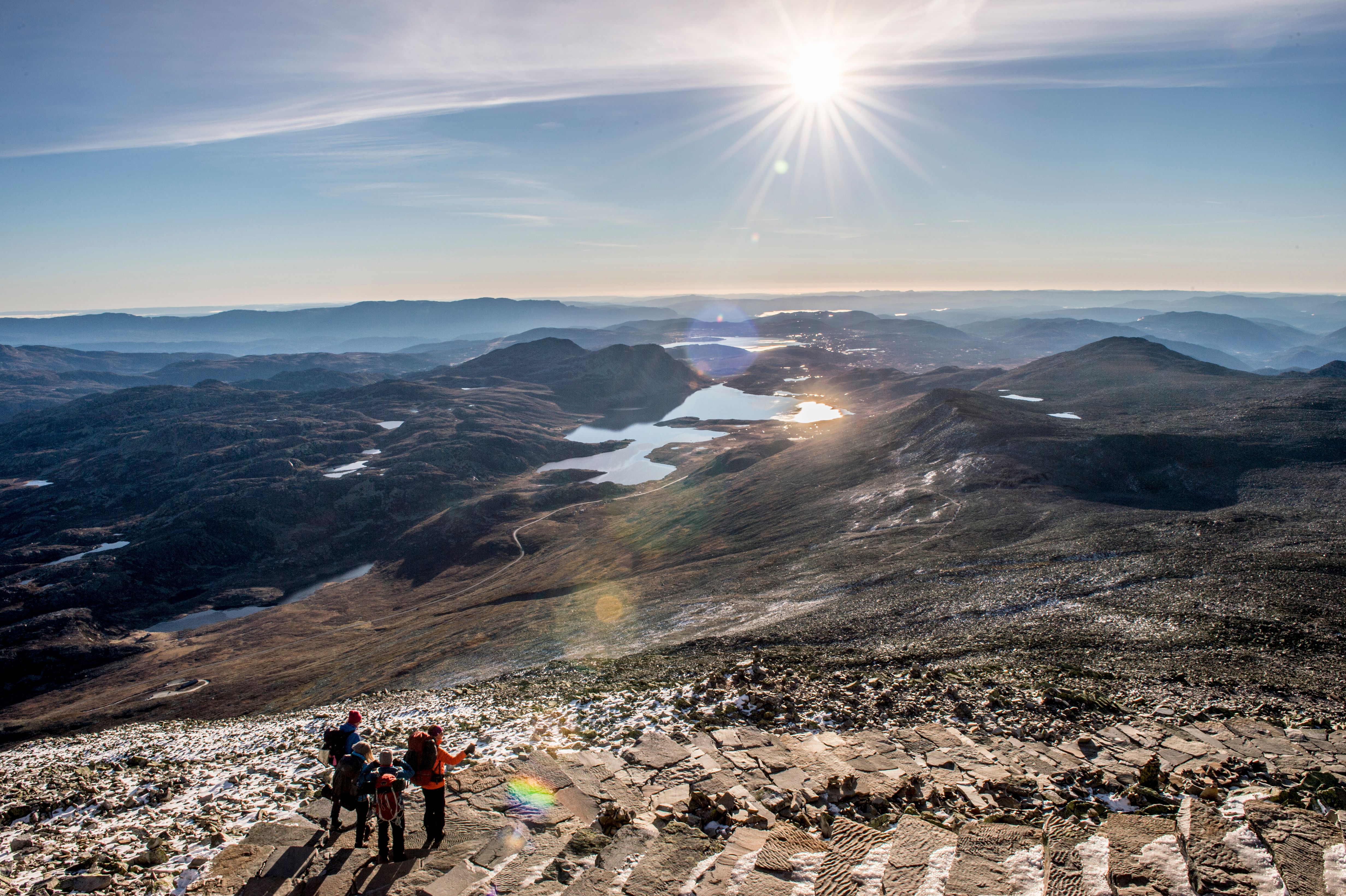 Four people hiking to Mount Gaustatoppen in Rjukan in Telemark, Eastern Norway