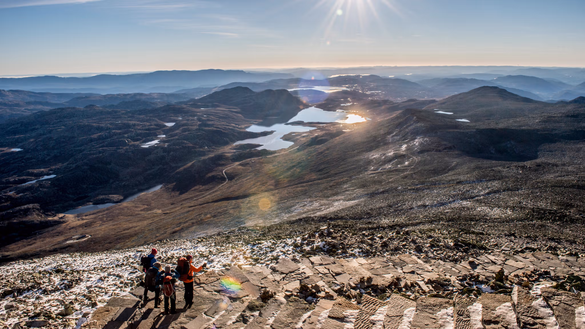 Four people hiking to Mount Gaustatoppen in Rjukan in Telemark, Eastern Norway