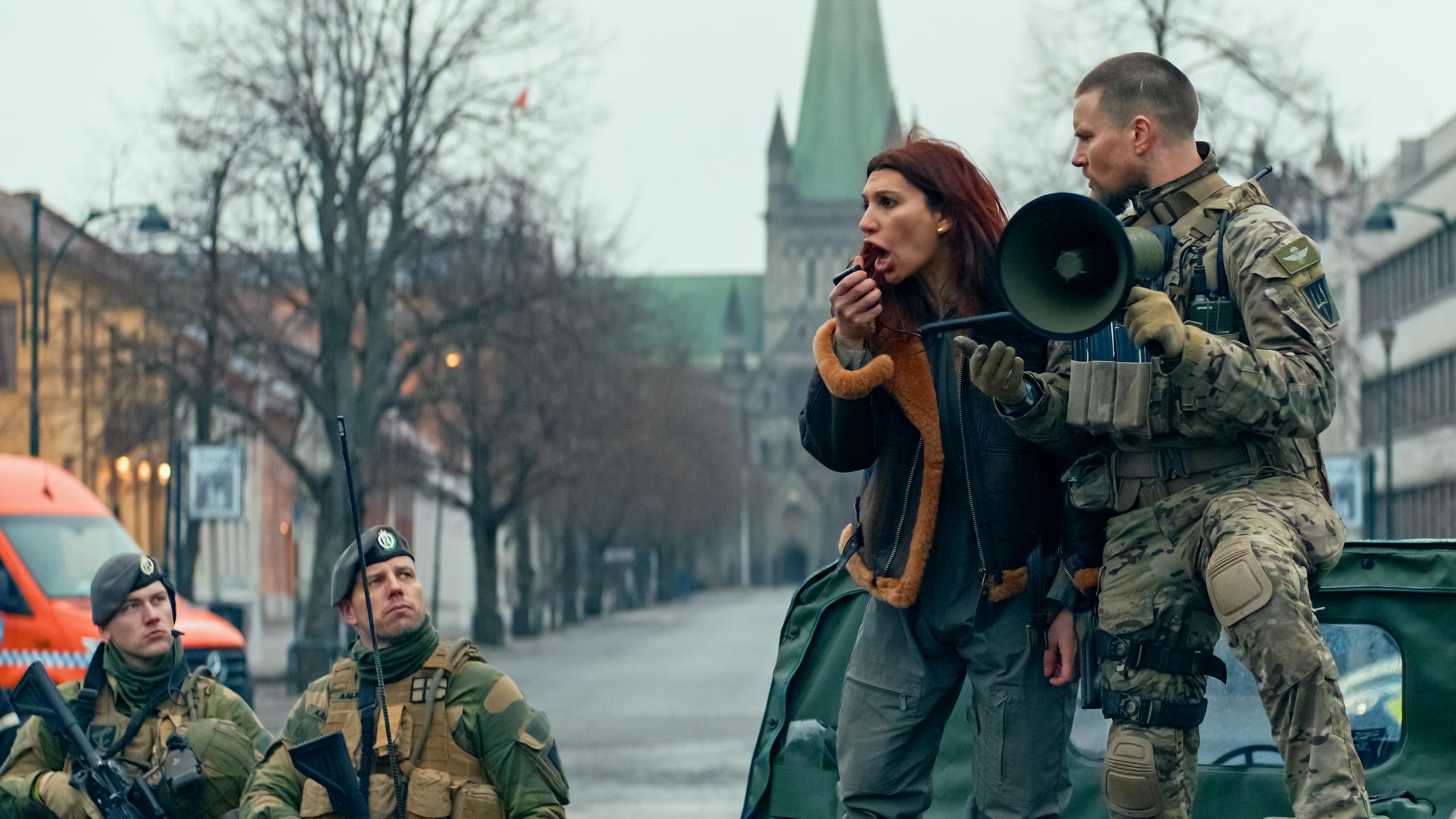 Characters from Troll 2 standing in front of Nidaros Cathedral in Trondheim.