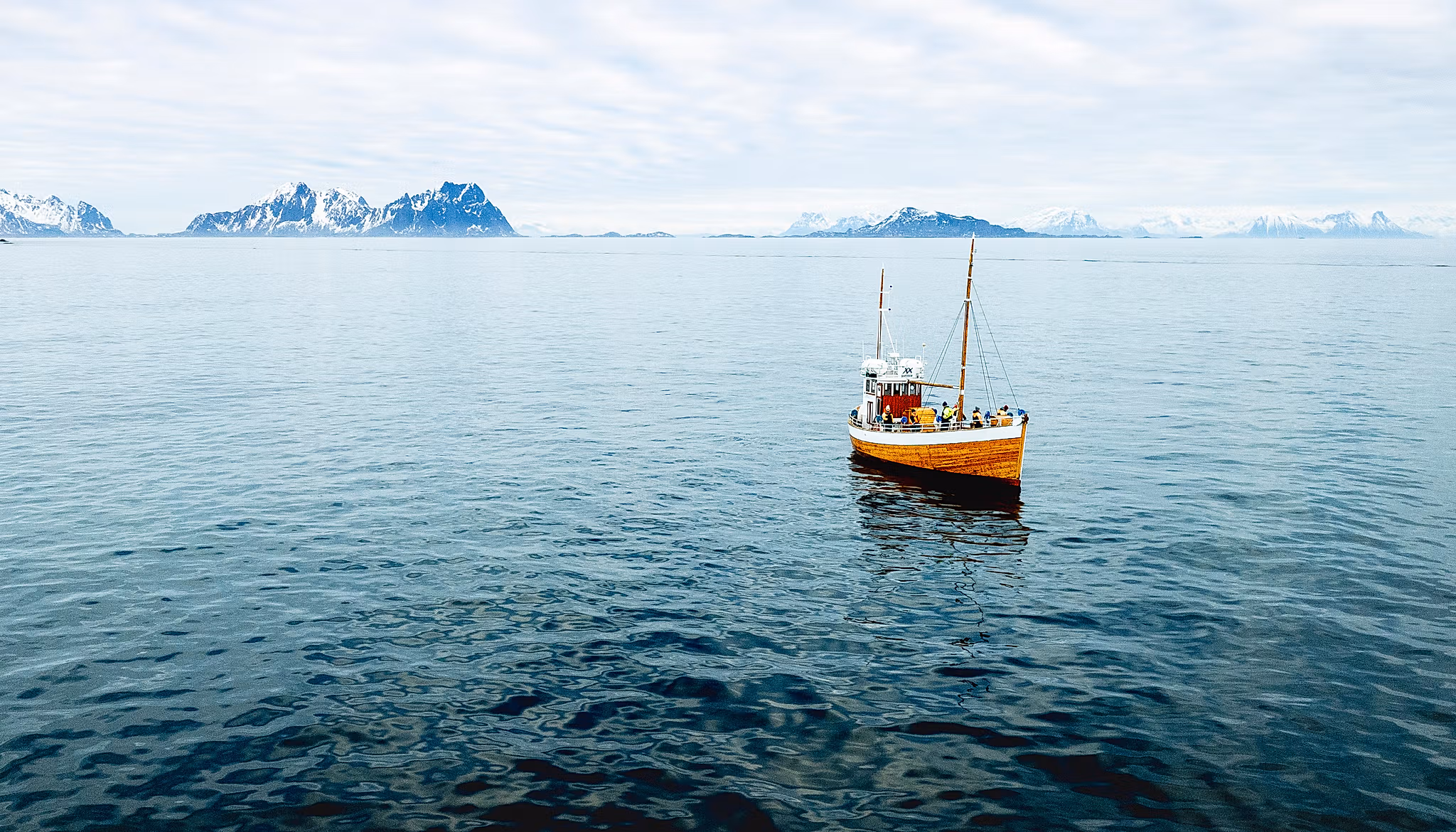 an old fishingboat out at sea in Lofoten