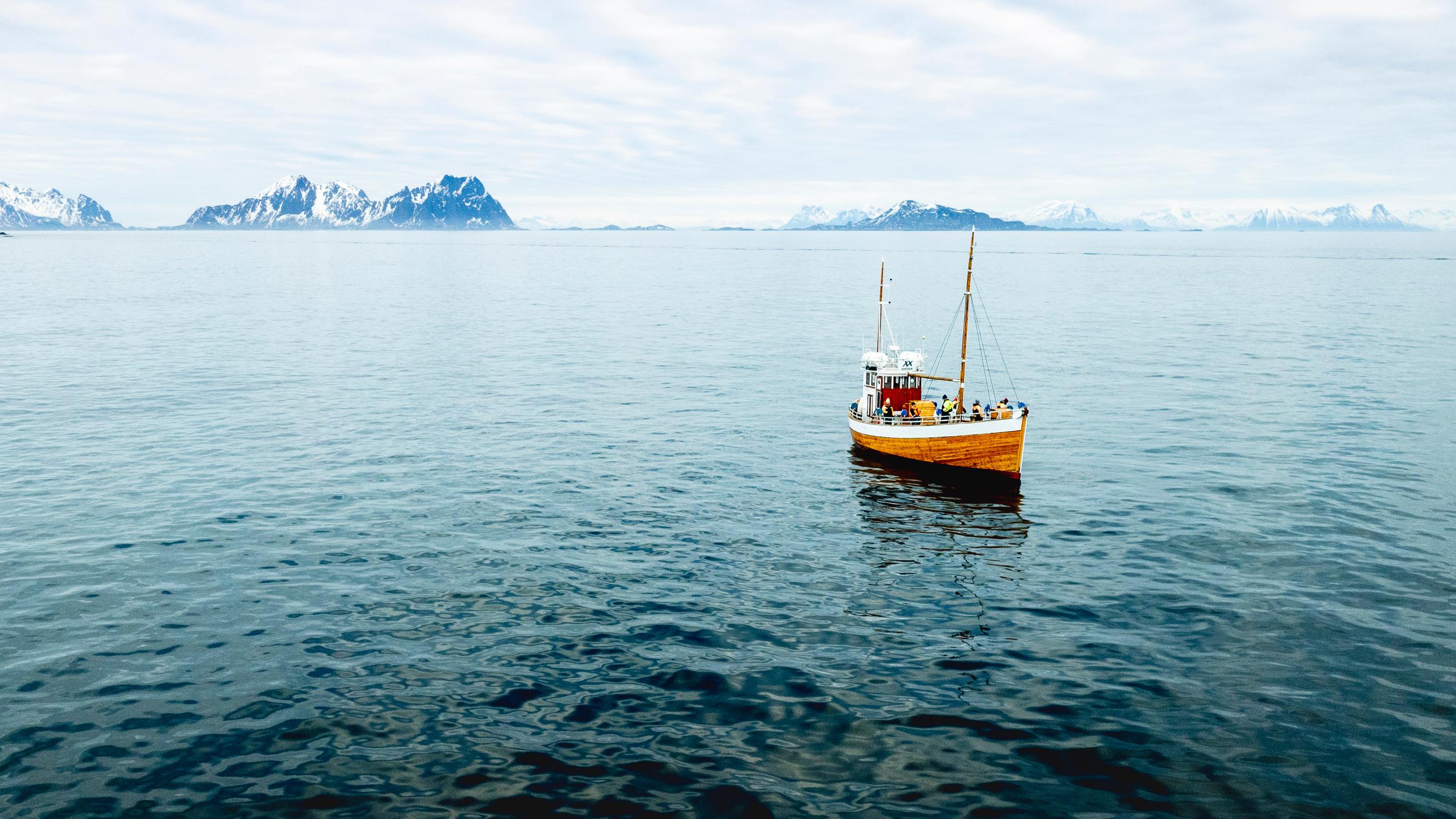 an old fishingboat out at sea in Lofoten