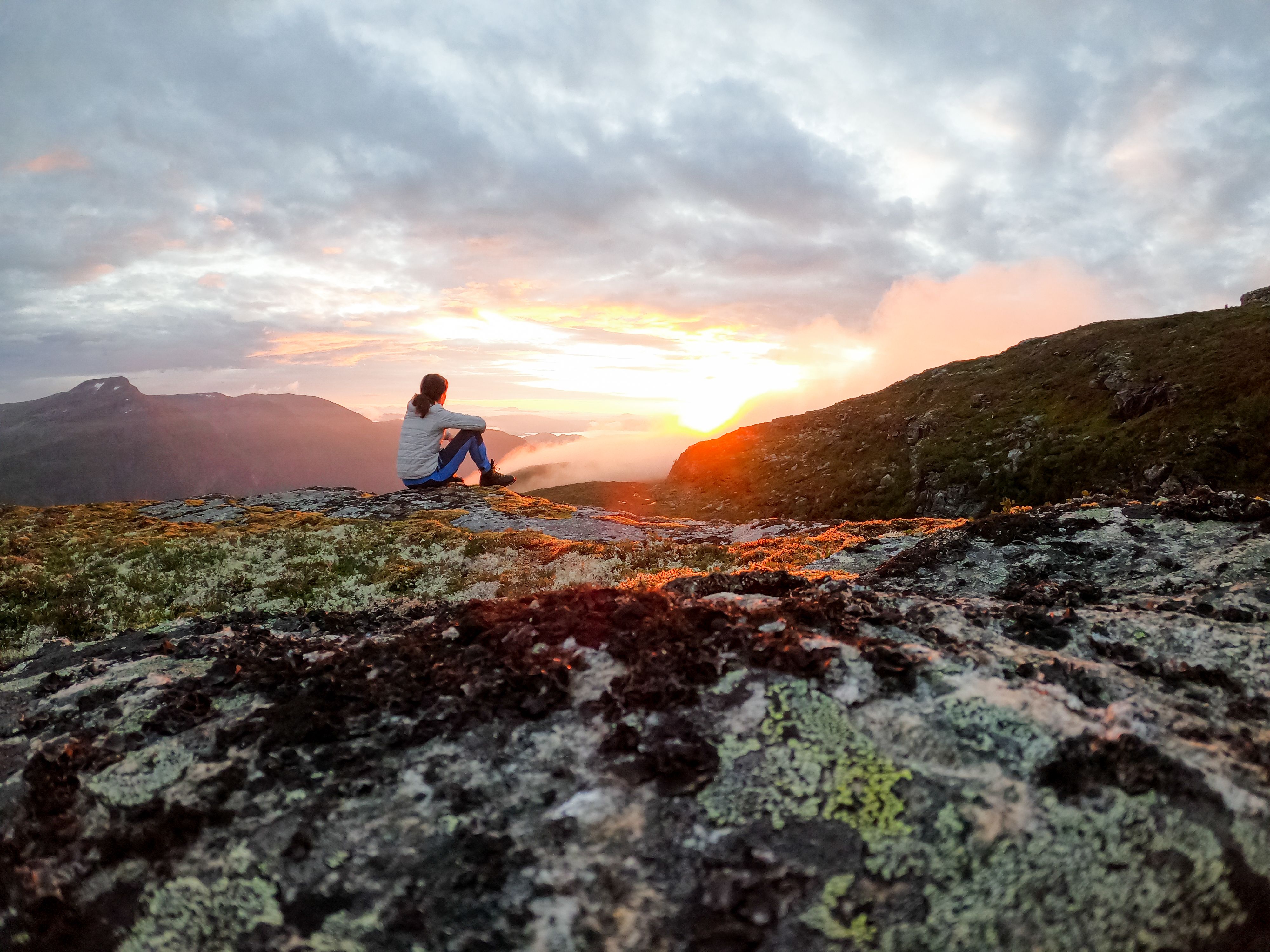 A person enjoying the sunset in Trollheimen