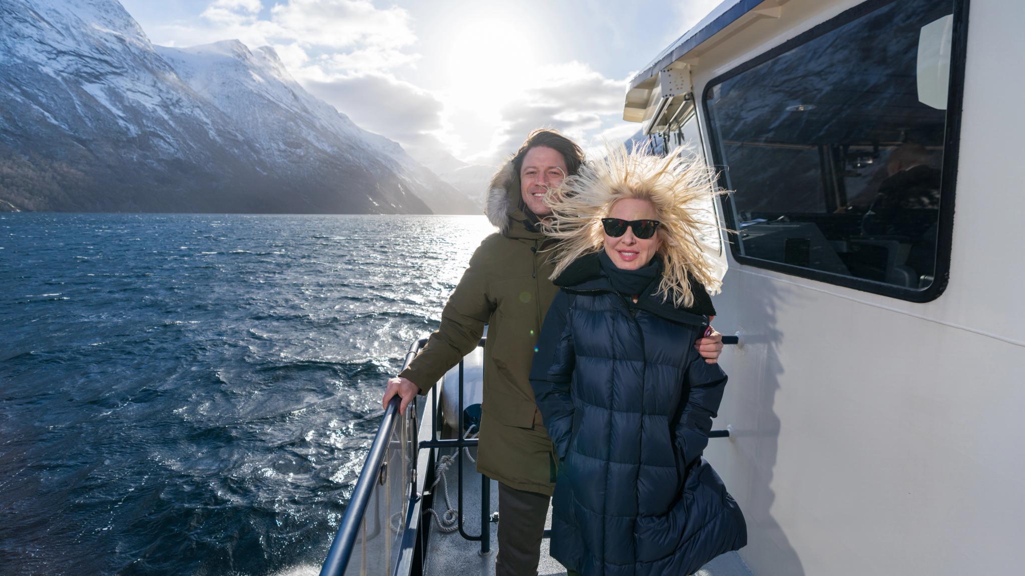 Man and woman in the wint at Fjordrangers cruise to Geiranger